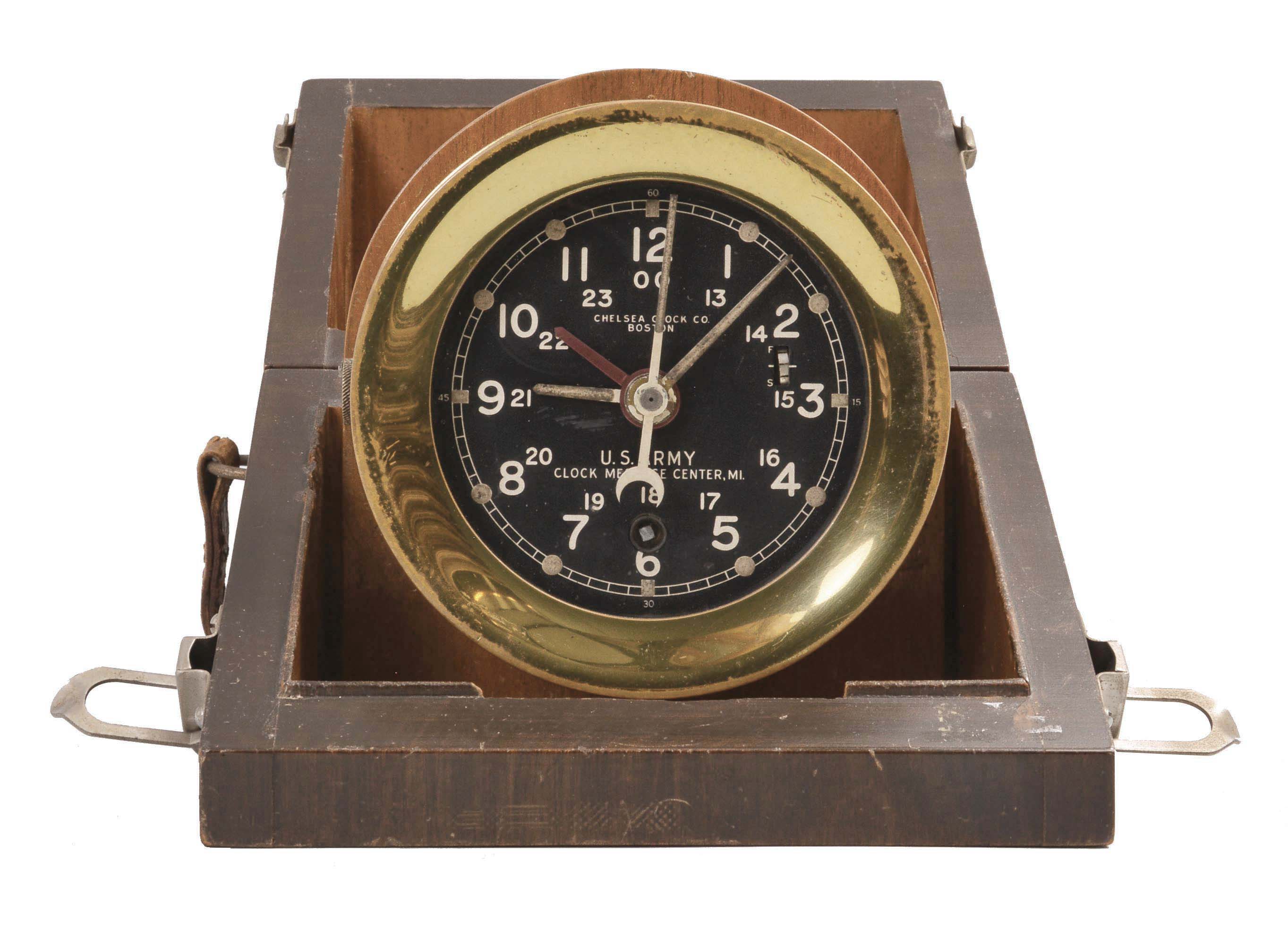 Chelsea Clock Co., Boston, Mass., "U.S. Army Message Center, Mark 1" deck timepiece, 8 day, time only, jeweled movement with lever escapement, center seconds with secondary hour hand, stem set at 9 o'clock position brass case with screw bezel and 4 inch black dial, all in a mahogany carrying case. — Antique Clocks Price Guide
