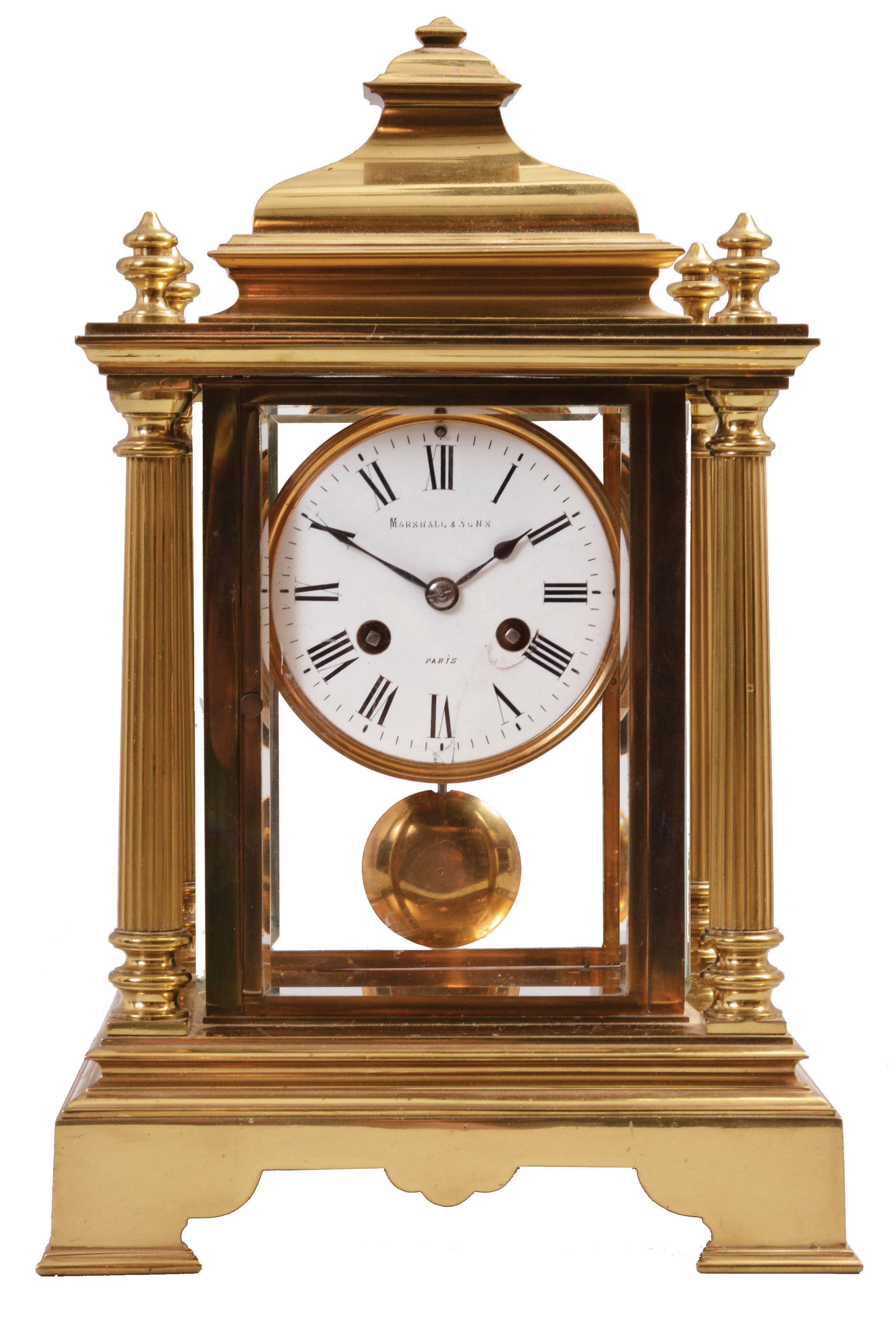 Marshall and Sons, Paris, crystal regulator, 8 day, time and strike, spring-driven pendule de Paris movement in a polished brass architectural case with four fluted columns and four beveled glasses, white enamel dial with Roman numerals and blued steel spade hands. — Antique Clocks Price Guide