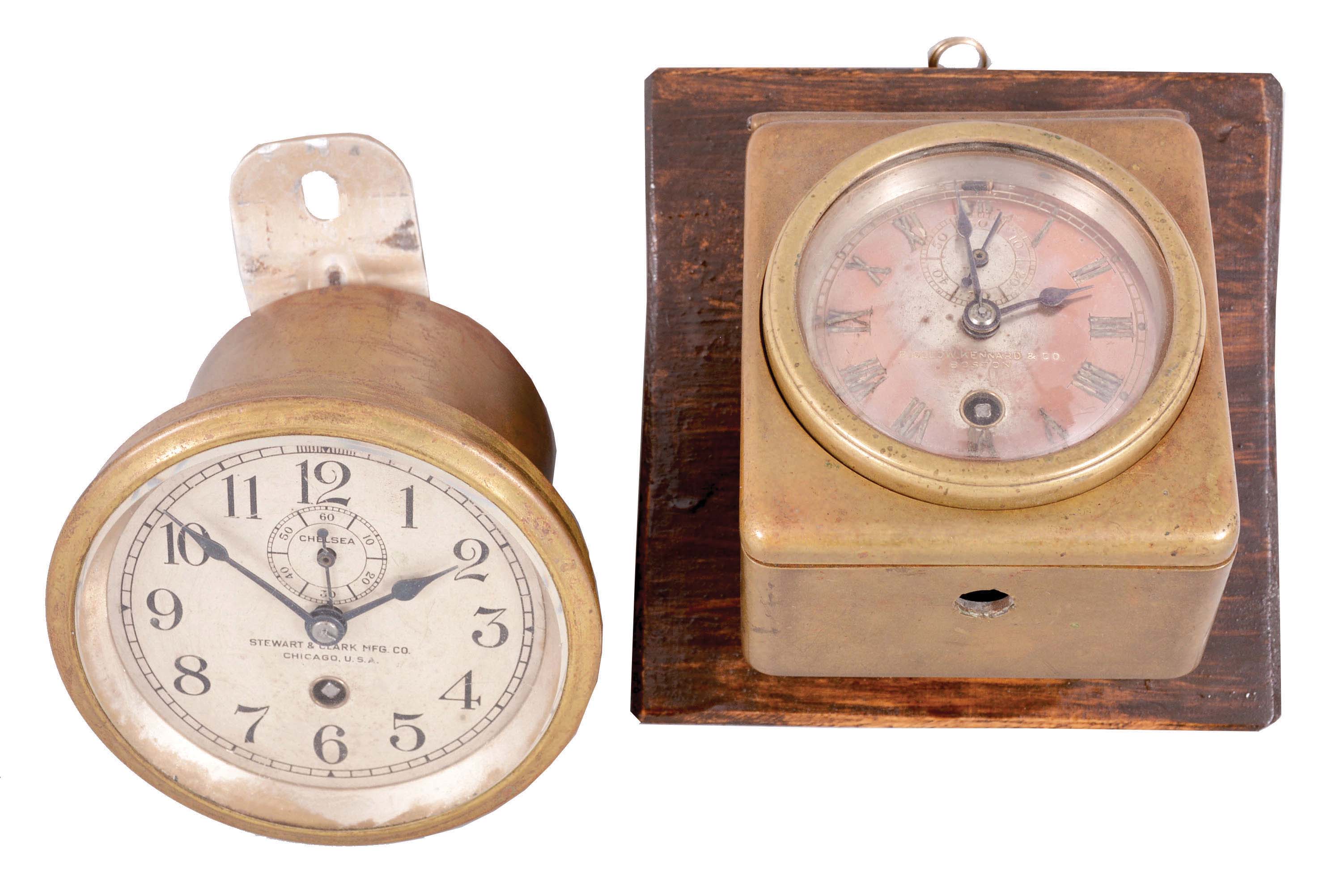 Clocks- 2 (Two) Chelsea Dash Clocks: (1) Chelsea Clock Co., Boston for Bigelow, Kennard, &amp; Co., Boston, "Special Auto" car clock, 8 day, time only, spring-driven balance wheel movement with 2.75in silvered dial in a brass case which in turn is held within a brass dash-mounted case. Serial number 14117, c1906; (2) Chelsea Clock Co., Boston for Steward &amp; Clark Mfg. Co., Chicago, 8 day, time only, spring-driven brass movement with a 3.5in silvered dial in a brass tub for mounting in a vehicle or instrument panel. Serial number 42828, c1909. — Antique Clocks Price Guide