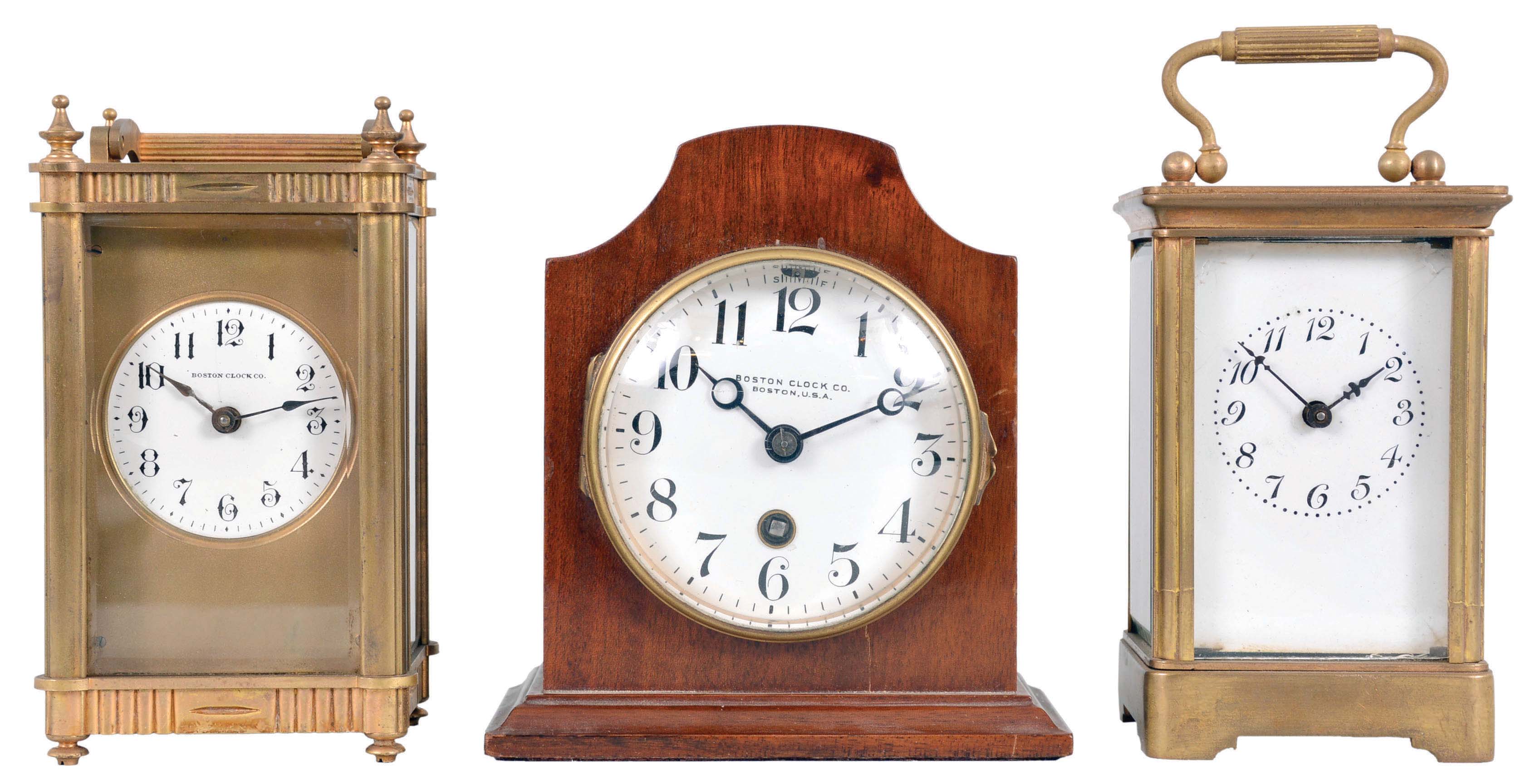 Clocks- 3 (Three) Boston and Vermont Clocks: (1) Boston Clock Co., Boston, "Sparta" carriage clock, 8 day, time only, spring-driven balance wheel movement in a gilt brass case with signed white enamel dial, serial number C4611; (2) Boston Clock Co., Boston, desk clock, 8 day, time only, spring-driven balance wheel movement in a mahogany case with white enamel dial, serial number 16322B; (3) Probably Vermont Clock Co., Fairhaven, VT, carriage clock, 8 day, time only, spring-driven balance wheel movement in a gilt brass case with white enamel dial. — Antique Clocks Price Guide