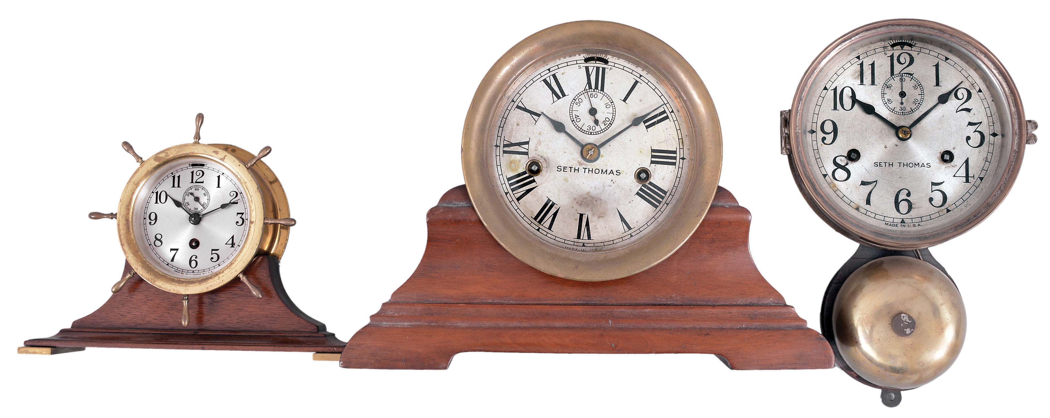 Clocks- 3 (Three) Seth Thomas Marine: (1) Seth Thomas, Thomaston, Conn., "Merrimac" ship's clock, 30 hour, time and ship's strike, spring-driven balance wheel movement in a brass case with hinged bezel on a wood stand, c1935; (2) Seth Thomas, Thomaston, Conn., "Ship's Bell", 30 hour, time and and ship's strike, spring-driven balance wheel movement in nickel plated case with outside bell, c1884; (3) Seth Thomas, Thomaston, Conn., "Clipper" marine clock, 8 day, time only, spring-driven balance wheel movement with yacht wheel bezel on a mahogany base, c1936. — Antique Clocks Price Guide