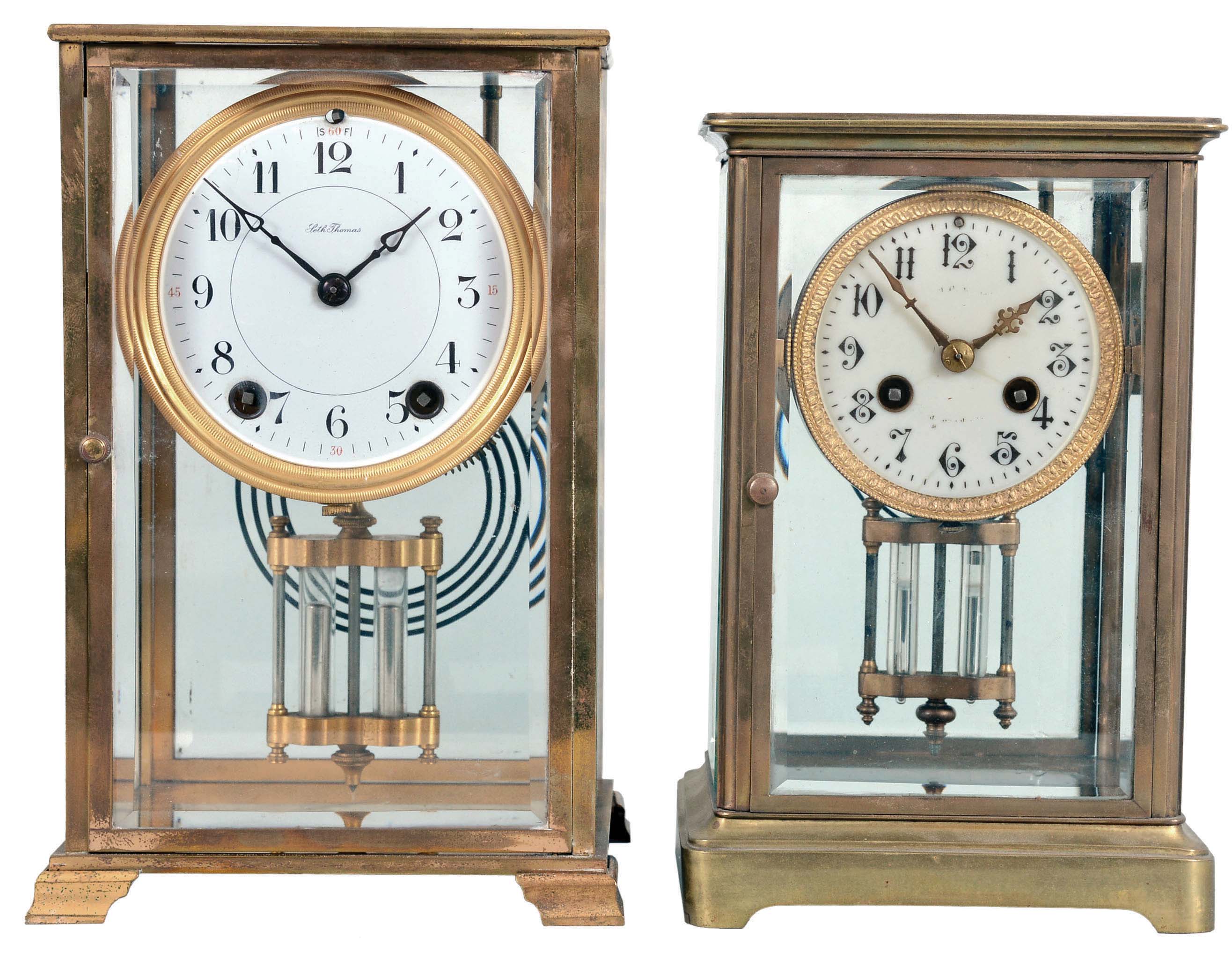 Clocks- 2 (Two) Crystal Regulators: (1) Seth Thomas, Thomaston, Conn., "Empire No. 306" crystal regulator, 8 day, time and strike, spring-driven round movement in a glazed brass case with white enamel dial and double-vial pendulum, c1913; (2) France, crystal regulator, 8 day, time and strike, spring-driven pendule de Paris movement in a glazed brass case with cream porcelain dial and double-vial pendulum, c1910. — Antique Clocks Price Guide