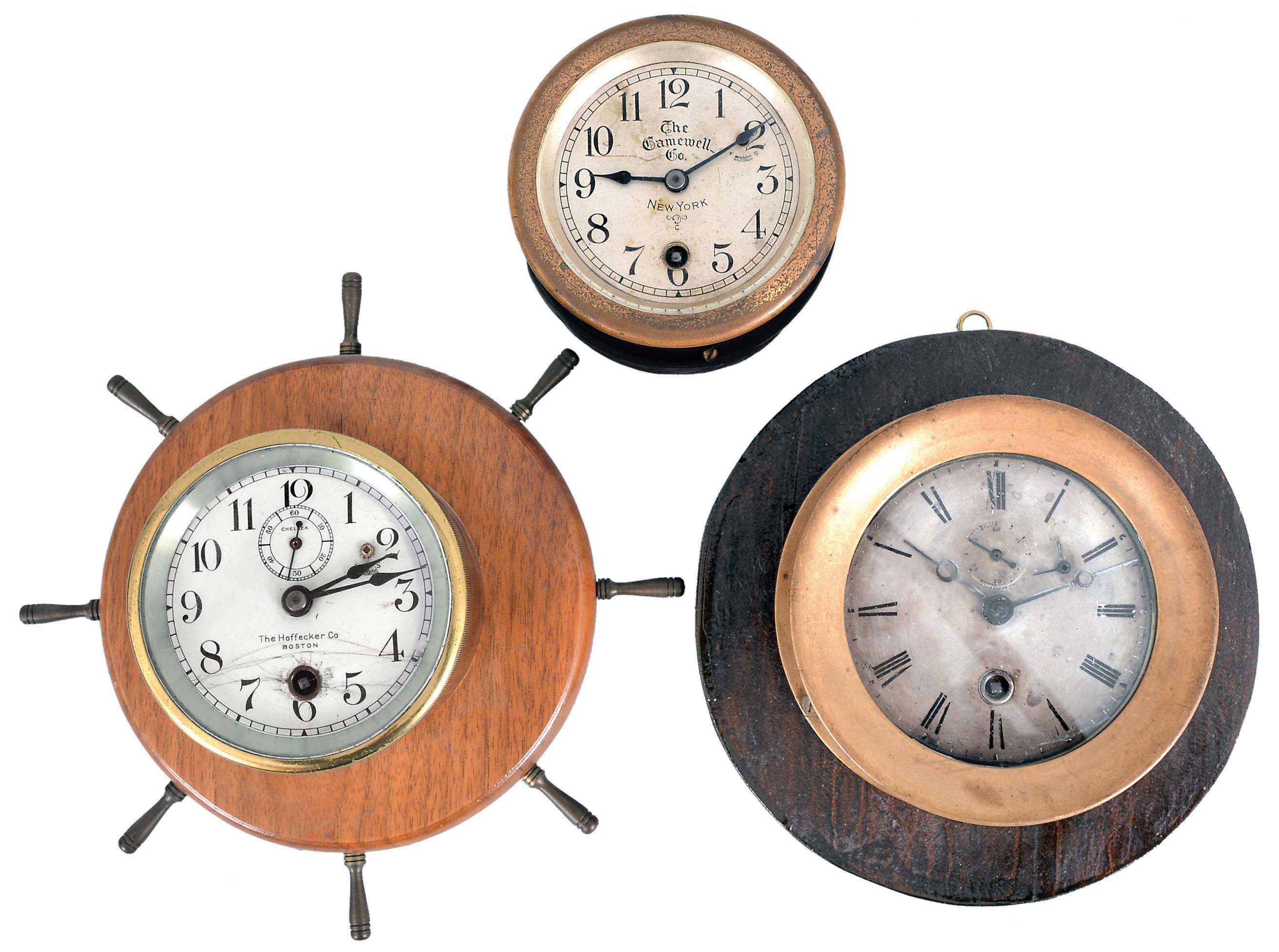 Clocks- 3 (Three) Early and Unusual Chelsea: (1) Chelsea Clock Co., Boston, marine timepiece, 8 Day, time only, spring-driven balance wheel movement in a brass case with screw-on bezel and silvered dial, extremely early serial number of 4241 stamped on the back of the case, c1900. (2) Chelsea Clock Co., Boston for The Gamewell Co., New York, timepiece, 8 day, time only, spring-driven balance wheel movement in a brass case with silvered dial, serial number 108688, c1917; (3) Chelsea Clock Co., Boston for The Hoffecker Co., Boston, timepiece, 8 day, time only, spring-driven balance wheel movement in a brass tub with white enamel dial. — Antique Clocks Price Guide