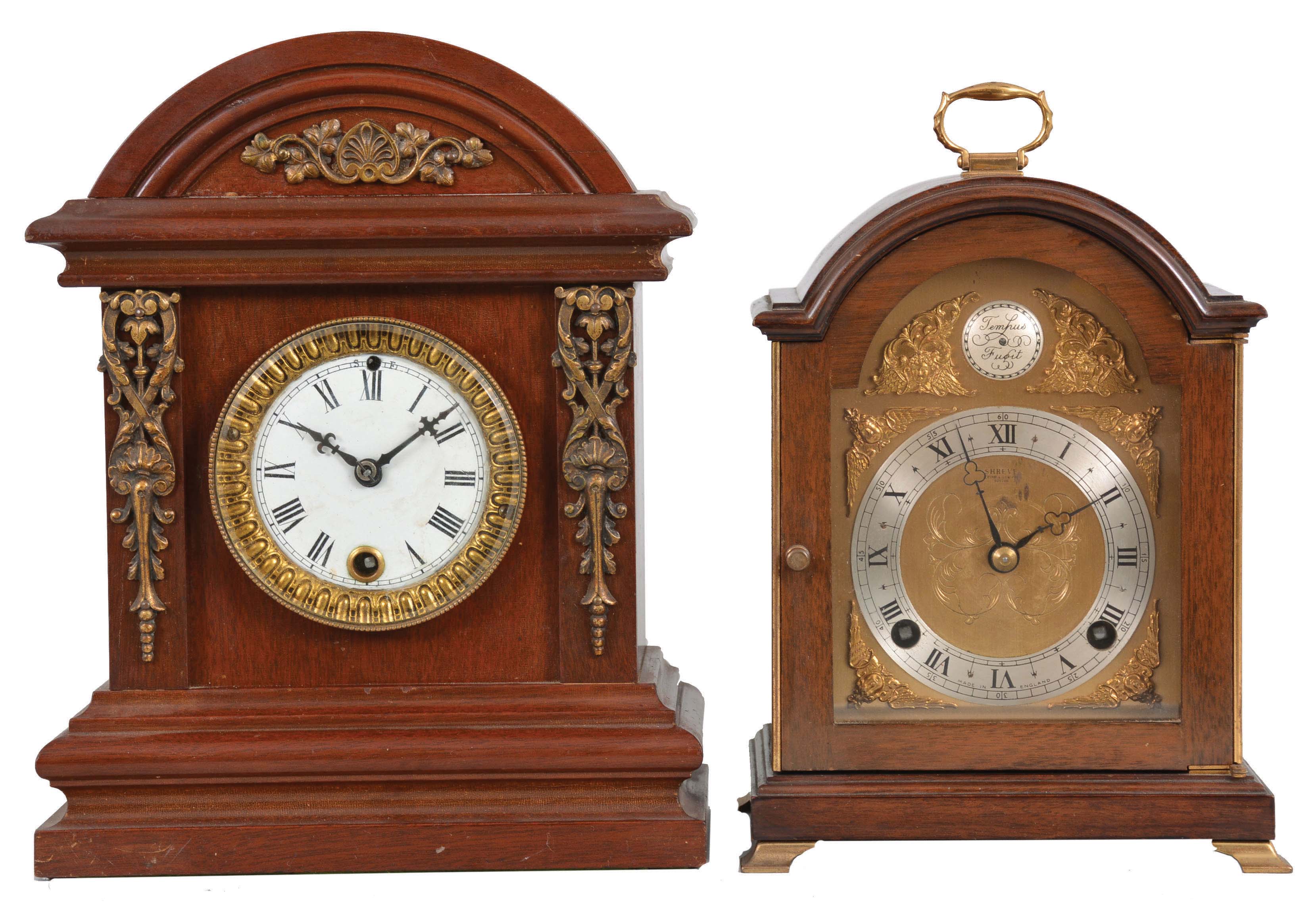 Clocks- 2 (Two) Mantel: (1) Ansonia Clock Co., New York, "Huddersfield" cabinet clock, 8 day, time only, spring-driven movement in a mahogany case with brass trimmings and white enamel dial, c1894; (2) F.W. Elliot, Croyden, England for Shreve, Crump &amp; Low, Boston, miniature bracket clock, 8 day, time and strike, spring-driven, 7 jewel balance wheel movement in a walnut case with brass dial, silver chapter ring, applied spandrels, trefoil hands, c1960. — Antique Clocks Price Guide