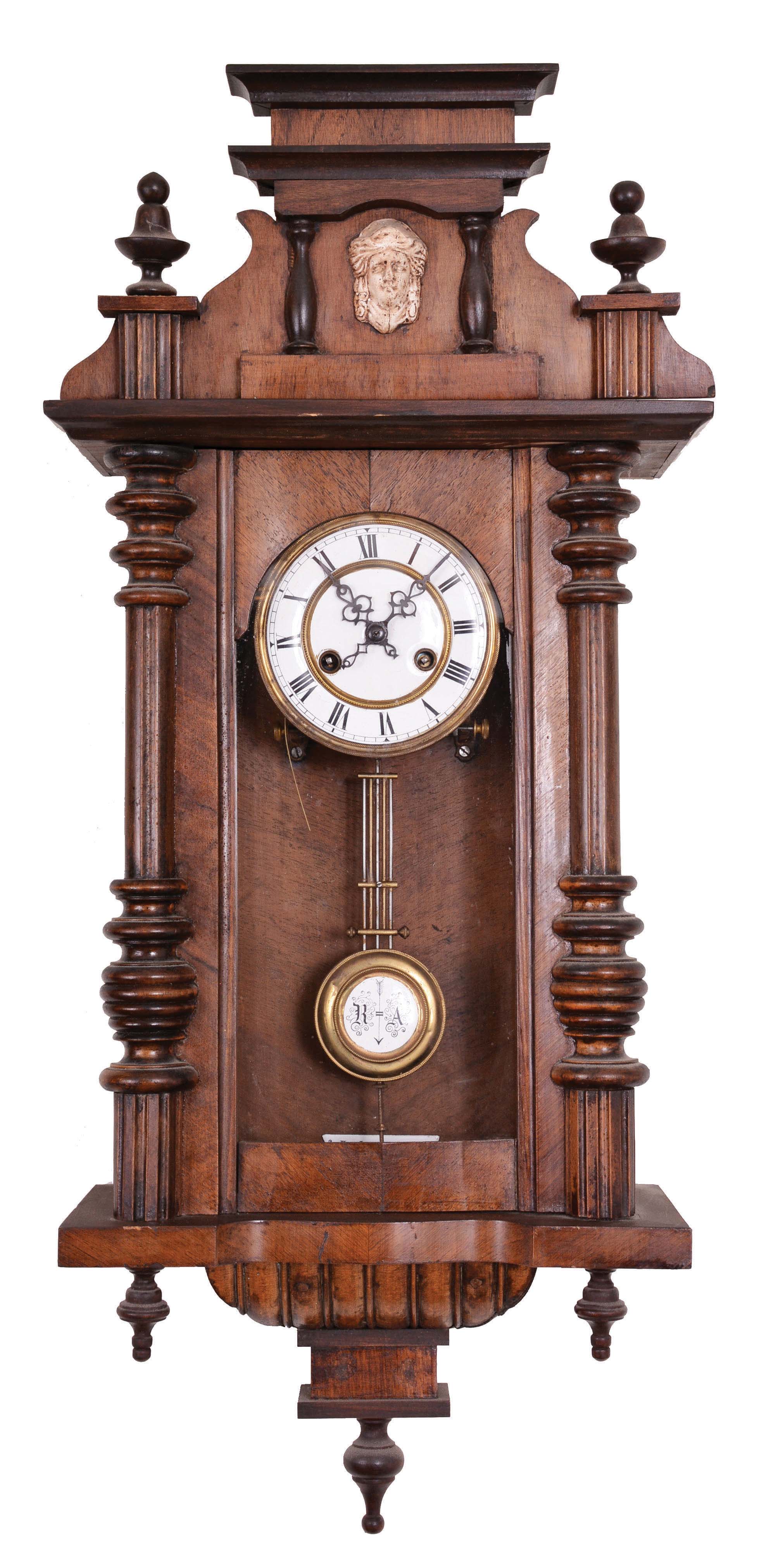 Clocks- 3 (Three) German RA Clocks: three RA clocks, 8 day, time and strike, spring-driven movements in walnut cases with top crests and turned finials by Friedrich Mauthe, Schlenker &amp; Kienzle, and one other unsigned. — Antique Clocks Price Guide