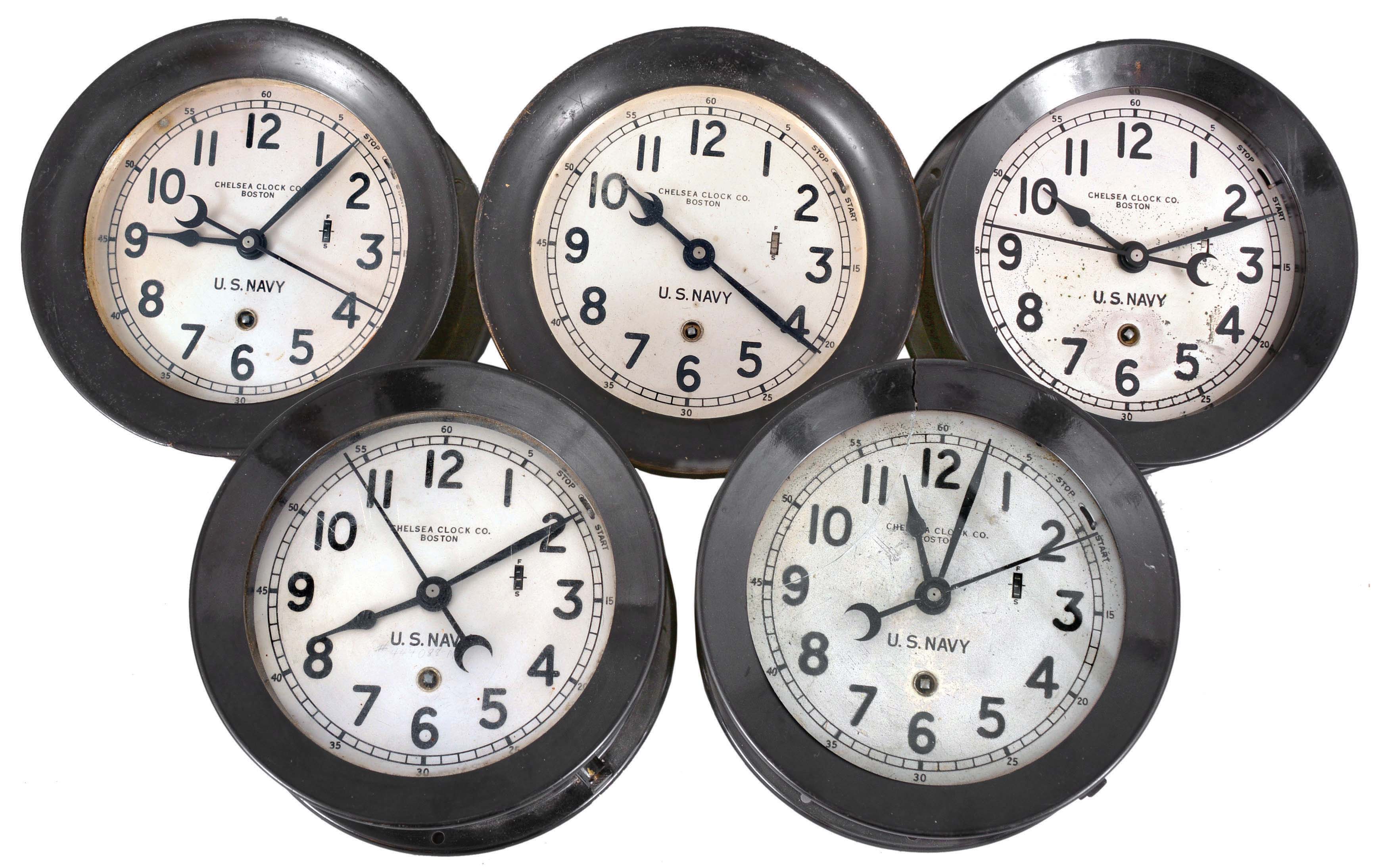 Clocks- 5 (Five) Chelsea Course Clocks: Chelsea Clock Co., Boston, for U.S. Navy, "Zig Zag 14E" course clocks, 8 day, time and course signal, spring-driven balance wheel movements in black metal and phenolic cases with top-hinged bezels, silvered dials, hack switch, and center seconds. When connected and coordinated, these clocks sent a signal to the ship's steering servos to automatically add variation to the ship's course, thus reducing the chances of being hit by a torpedo. — Antique Clocks Price Guide