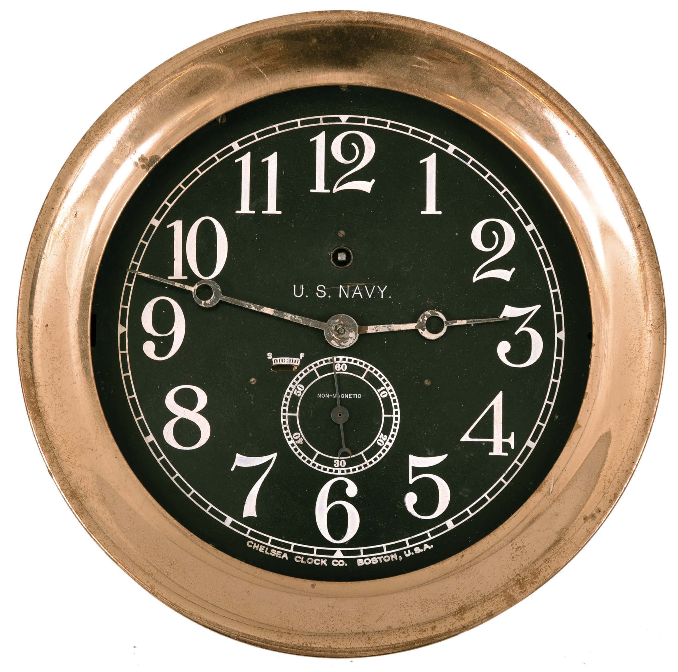 Chelsea Clock Co., Boston, Mass., for U.S. Navy, "Pilot House" timepiece, 8 day, time only, spring-driven rectangular movement in a polished brass case with 8.5 inch black dial and large subsidiary seconds below the center arbor. — Antique Clocks Price Guide