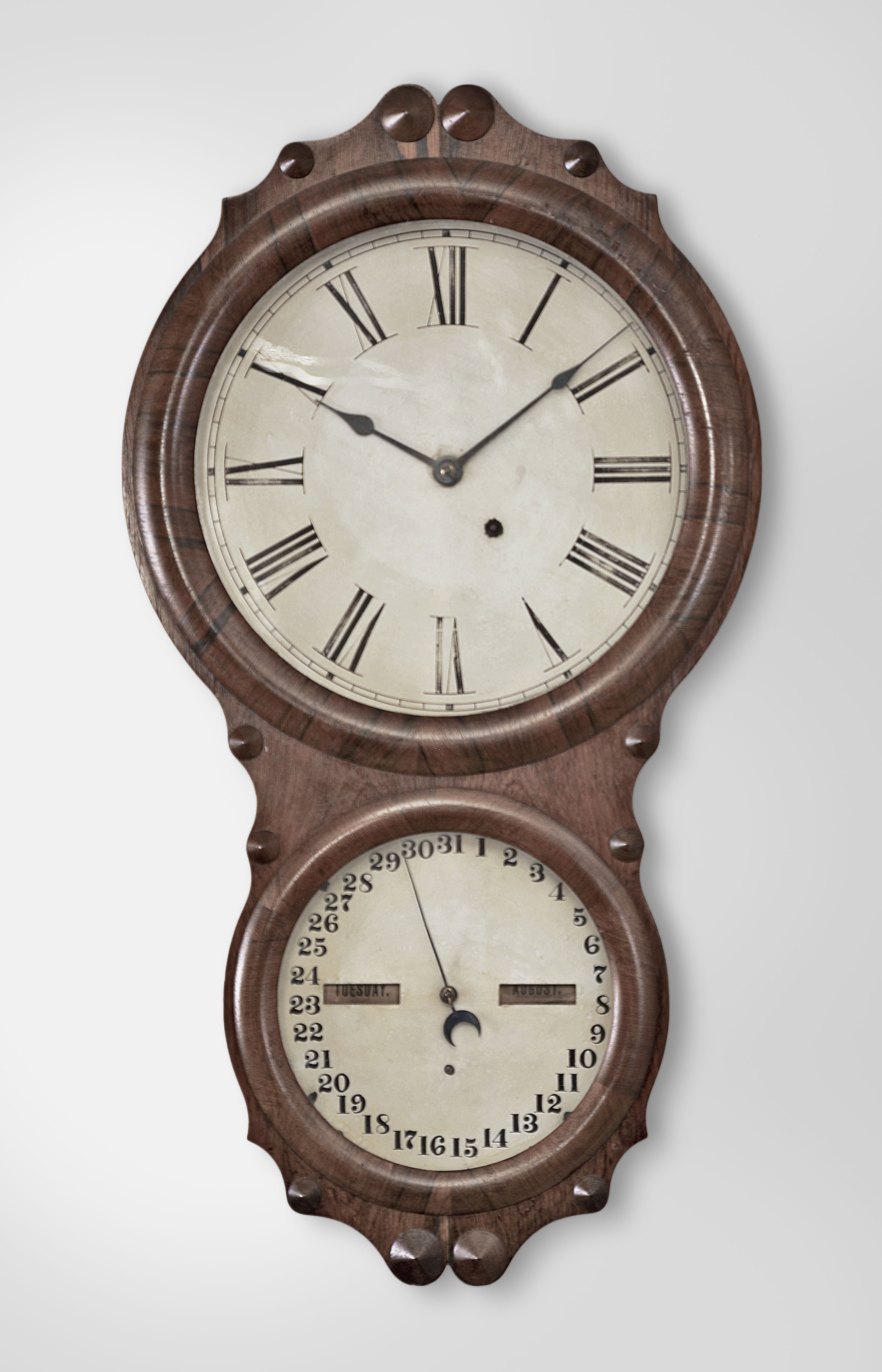 Seth Thomas Clock Co., Thomaston, Conn., "Office Calendar No. 4" wall clock, 8 day, spring driven movement with perpetual calendar displayed the lower dial, all in a rosewood veneered case. — Antique Clocks Price Guide