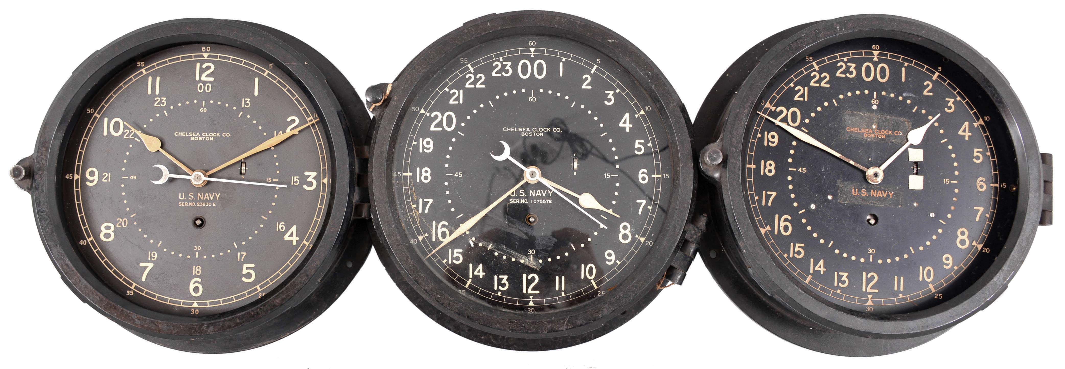 Clocks- 6 (Six) Chelsea Engine Room Clocks: Chelsea Clock Co., Boston, Mass., for the U.S. Navy, "Deck &amp; Engine Room" clocks, 8 day, time only, spring-driven balance wheel movements with center seconds in black phenolic cases with hinged bezels, 8.5 inch black dials showing both 12 and 24 hours. — Antique Clocks Price Guide