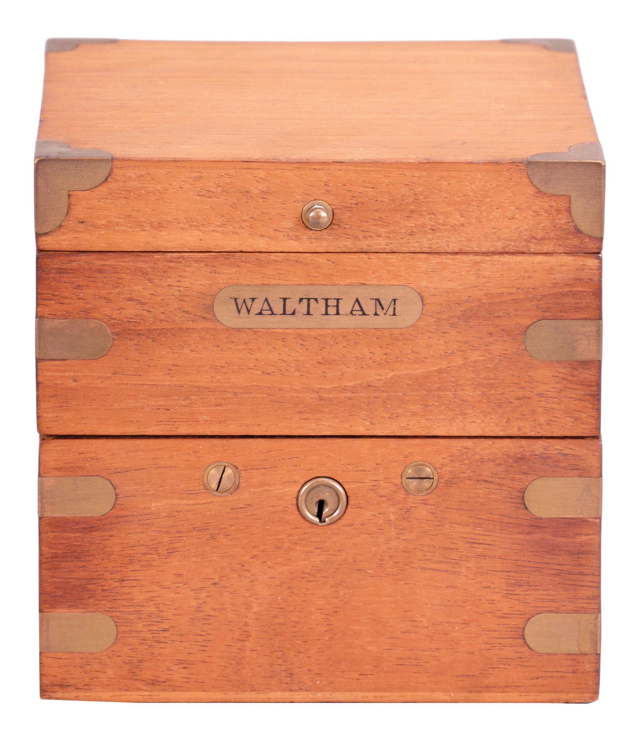 American Waltham Watch Co, Waltham, Mass., an 8 day mounted deck watch, 35 size, 15 jewels, stem wind and set, adjusted, damascened, nickel plate movement, Roman numeral silvered dial with blued steel hands, contained in a gimballed brass bowl with knurled silver bezel, the side engraved "U.S. Navy N428, and three tier mahogany box, the front with brass Waltham nameplate. — Antique Clocks Price Guide