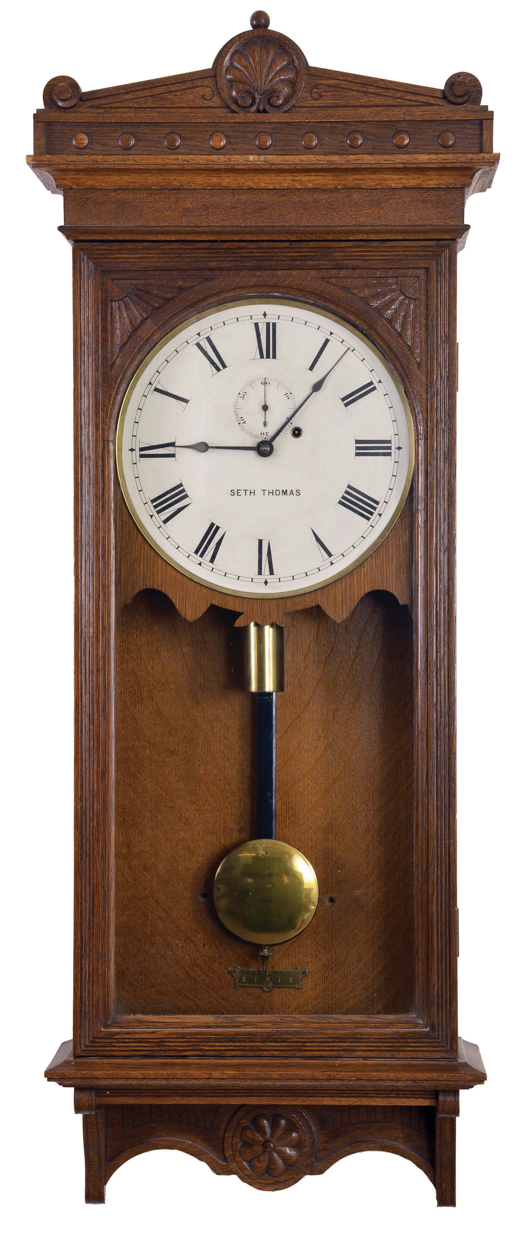 Seth Thomas Clock Co., Thomaston, Conn., "Regulator No. 30", wall clock, 8 day, time only, brass weight driven movement in a oak case with a painted metal dial — Antique Clocks Price Guide