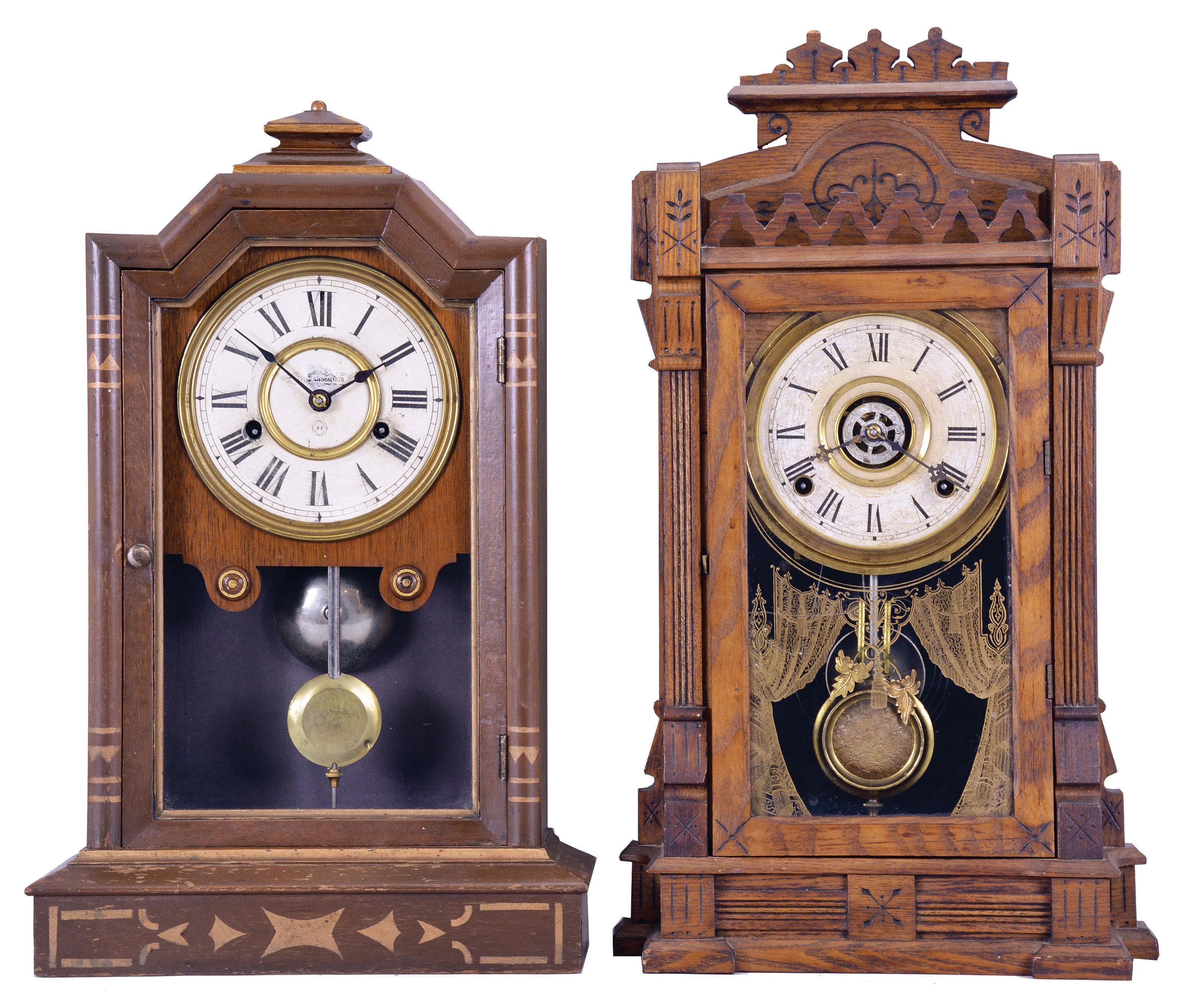 Clocks- 2 (Two): (1) Seth Thomas Clock Co., Thomaston, Conn., "Atlanta" city series shelf clock with a spring driven, 30 hour, time and strike movement in a walnut case, c1880. (2) William L. Gilbert Clock Co., Winsted, Conn., "Dacca" shelf clock with a spring driven, 8 day, time, strike and alarm movement in an ash wood case, c1885 — Antique Clocks Price Guide