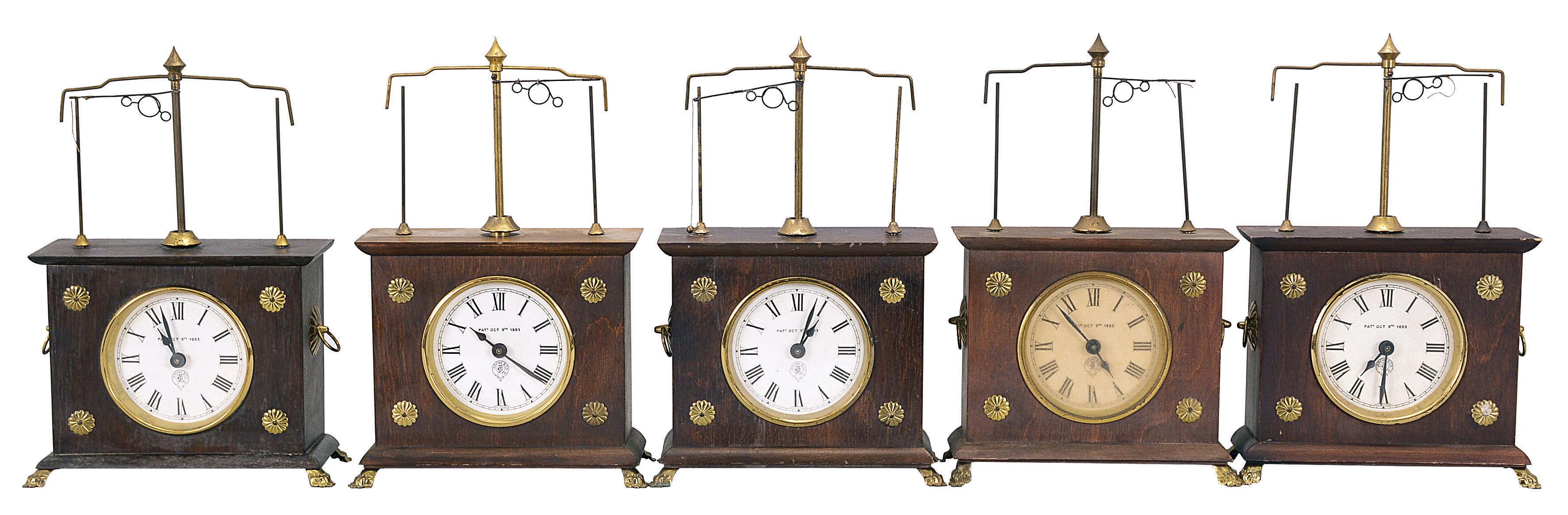Clocks- 5 (Five) Ignatz Flying Pendulum: Horolovar Clock Co., Bronxville, New York, reproduction "Ignatz Flying Pendulum" novelty clock, 8 days, time only, spring-driven movement with flying pendulum in wood cases with paper dials. These are German-made reproductions of the 19th century model made by the New Haven Clock Co. under the Jerome label. — Antique Clocks Price Guide
