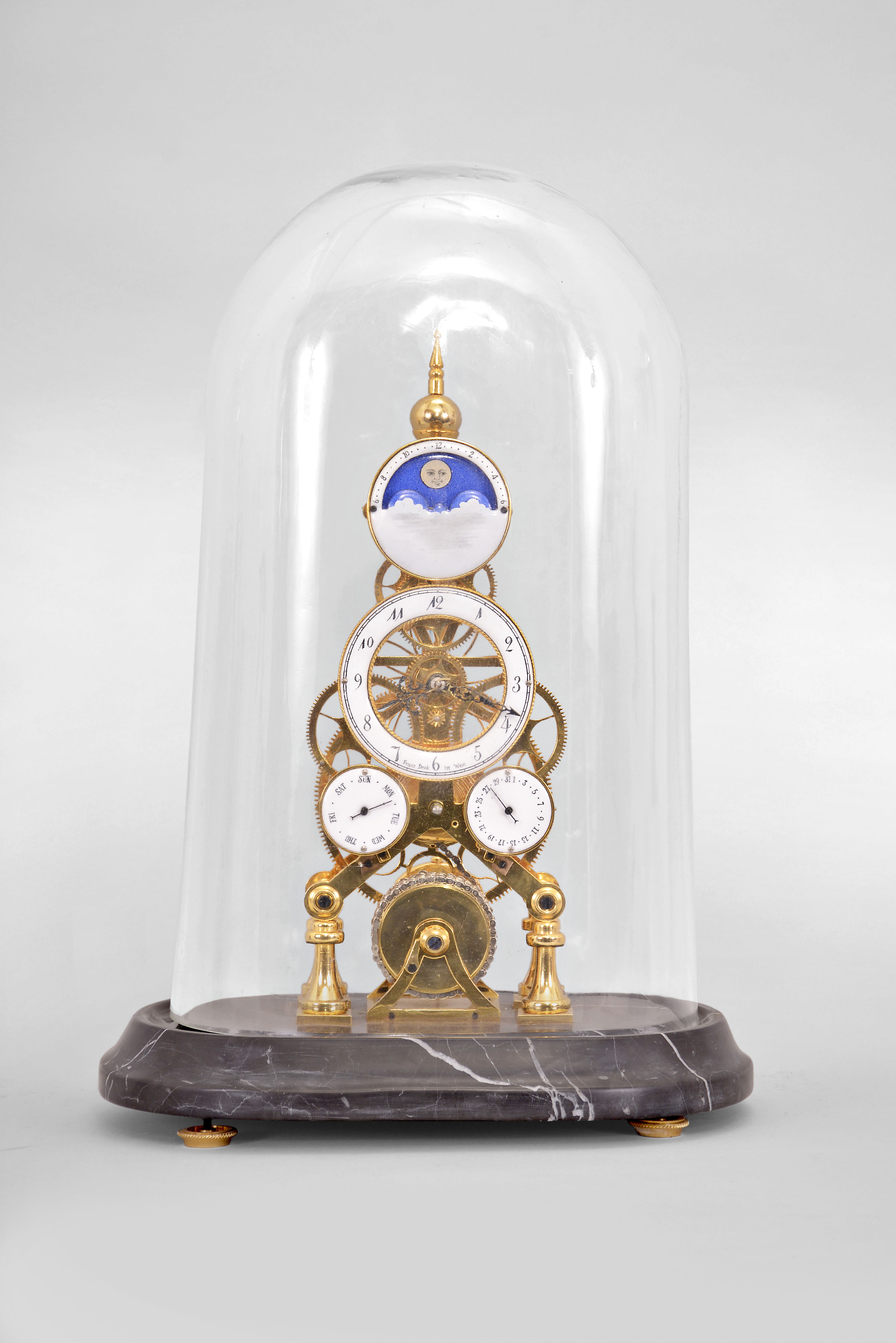 Clocks- 3 (Three): (1) France, portico clock, 8 day, time and strike, spring driven pendule to Paris movement with gridiron pendulum in a case featuring a riot of decorative elements including tortoise shell veneer, ebonized twist turned columns, and cast brass garlands, capitals and edge molding, with a white enamel dial and blued steel Breguet style hands, c1860; (2) Horolovar, Bronxville, New York, reproduction of 1855 Briggs rotary clock, 8 day, time only, spring driven movement with conical pendulum on a wood base under a glass dome, c1980; (3) Skeleton clock reproduction, 8 day, time and calendar functions with moon phase, spring driven fusee movement in a polished brass skeletonized frame on a black marble base, all under an oval glass dome, c1990. — Antique Clocks Price Guide