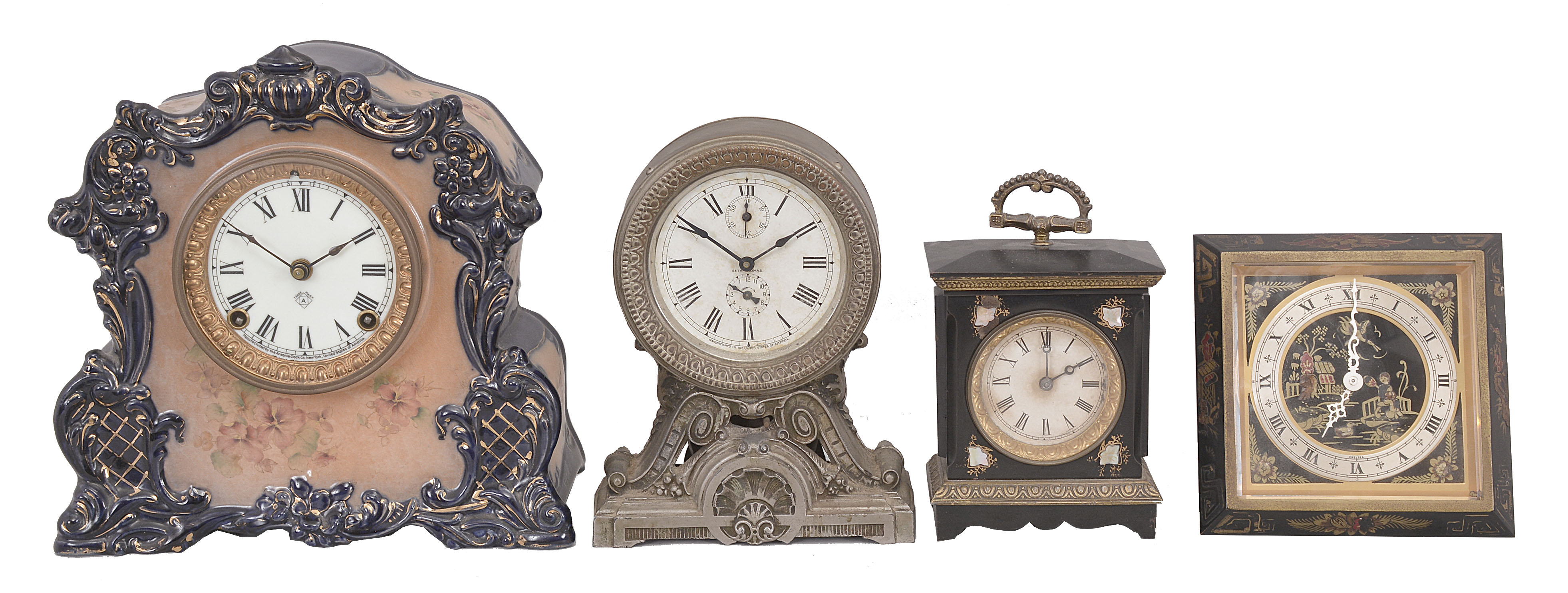 Clocks- 4 (Four): (1) Ansonia Clock Co., "Vigor" mantel clock, 8 day, time and strike, spring-driven movement in a porcelain case, c1900; (2) Seth Thomas Clock Co., "Long Alarm", 30 hour, time and alarm, spring-driven movement in a metal case, c1910; (3) Wm. L. Gilbert Clock Co., "No. 8054 Pearl", 30 hour, time and alarm, spring-driven movement in an iron case with MOP, c1881; (4) Chelsea Clock Co., "Chinese Lacquer" desk clock, 8 day, time only, serial # 537333, c1949. — Antique Clocks Price Guide