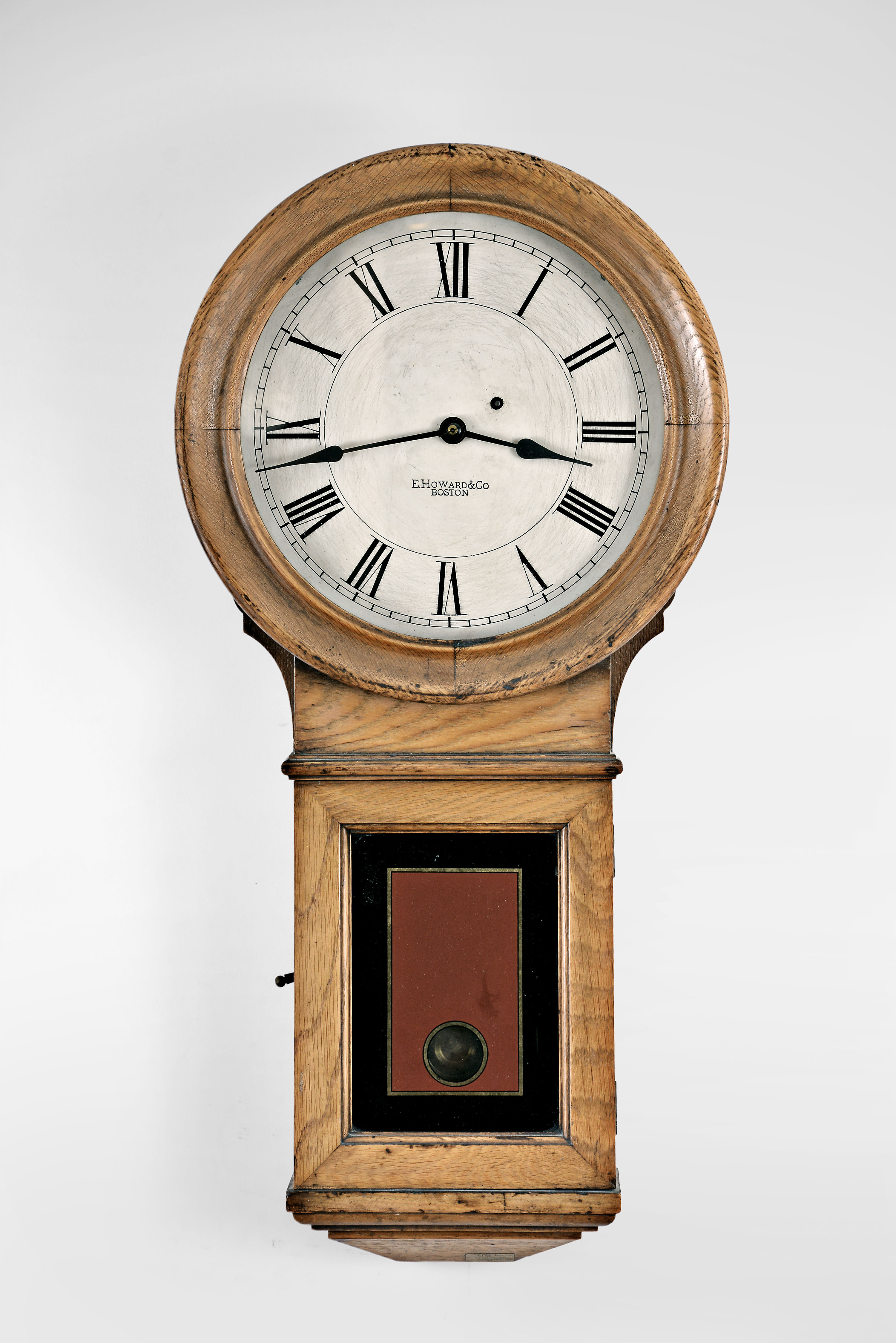 E. Howard &amp; Co., Boston, Mass., "Regulator No. 70" 8 day, weight brass movement wall timepiece. This example once resided in a firehouse as evidenced by the label attached on the bottom that reads "City of Boston, Fire-a-90 " — Antique Clocks Price Guide