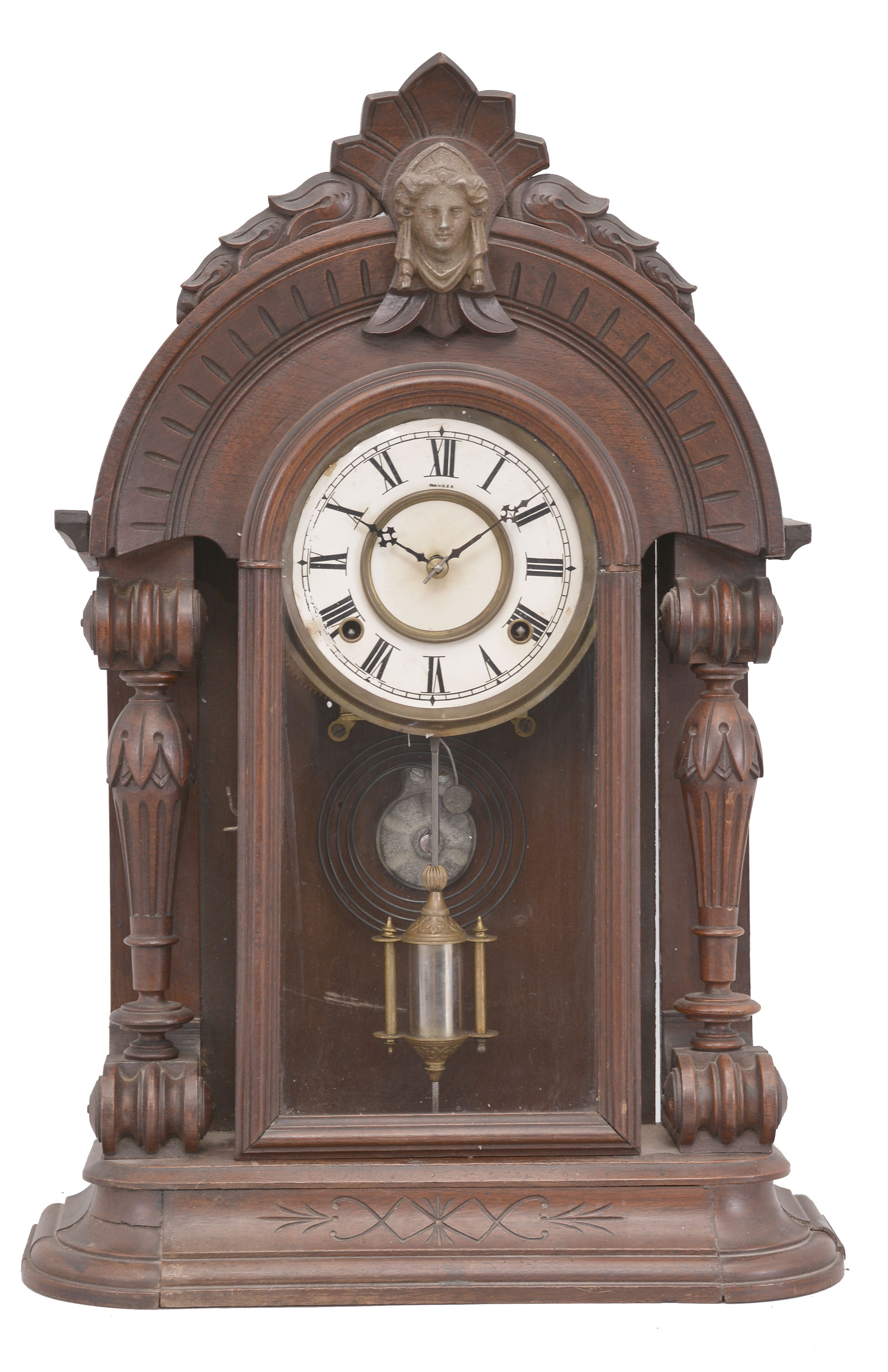E. N. Welch, Forestville, Conn., unknown model, 8 day, time and strike, spring driven movement in a walnut case with full carved columns. — Antique Clocks Price Guide