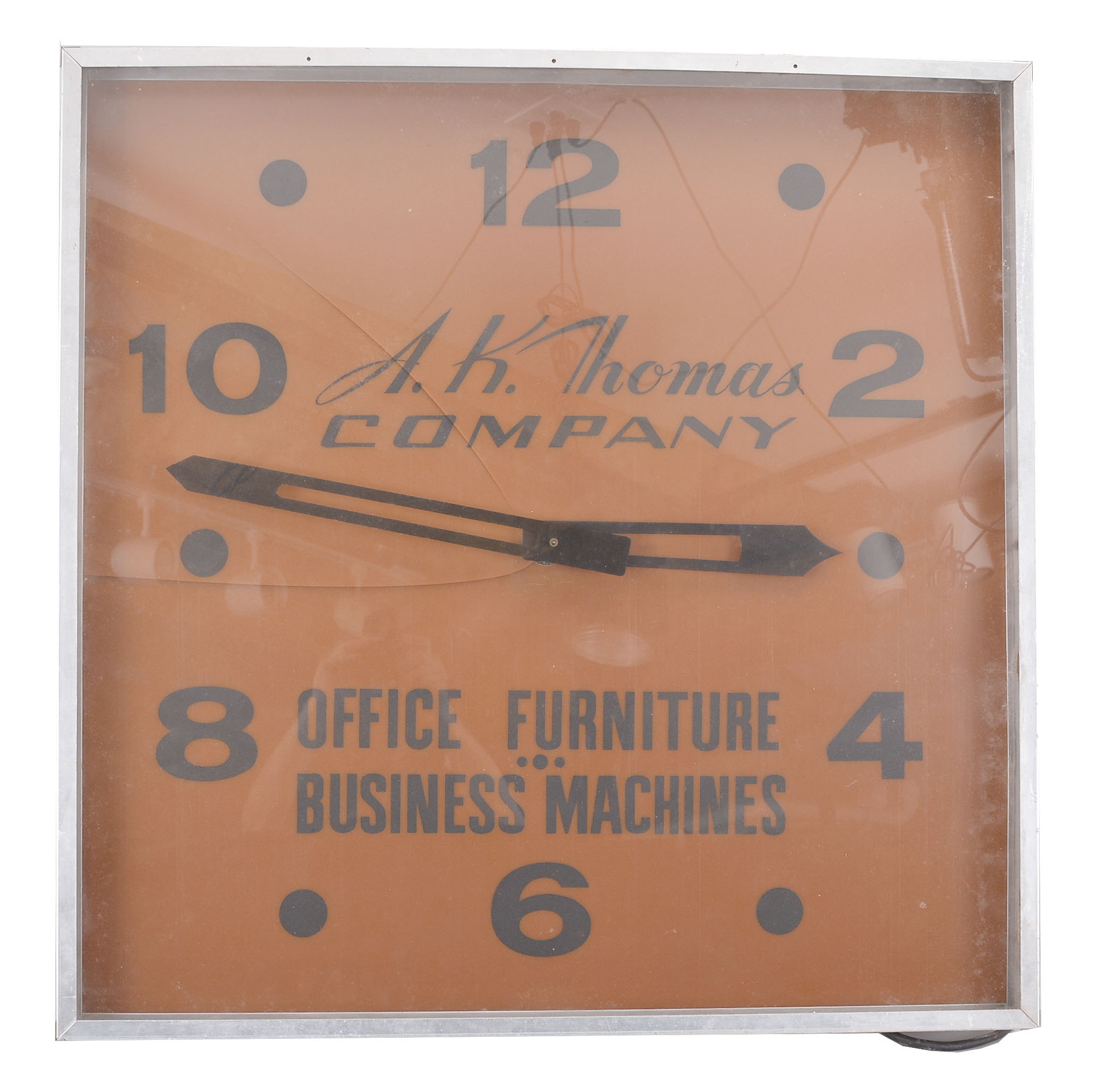 Modern Clock Advertising Co., Brooklyn, New York, outdoor store advertising clock, 120v AC electric motor-driven movement in an aluminium housing, the acrylic dial reading "A.K. Thomas Company / Office Furniture / Business Machines ". — Antique Clocks Price Guide