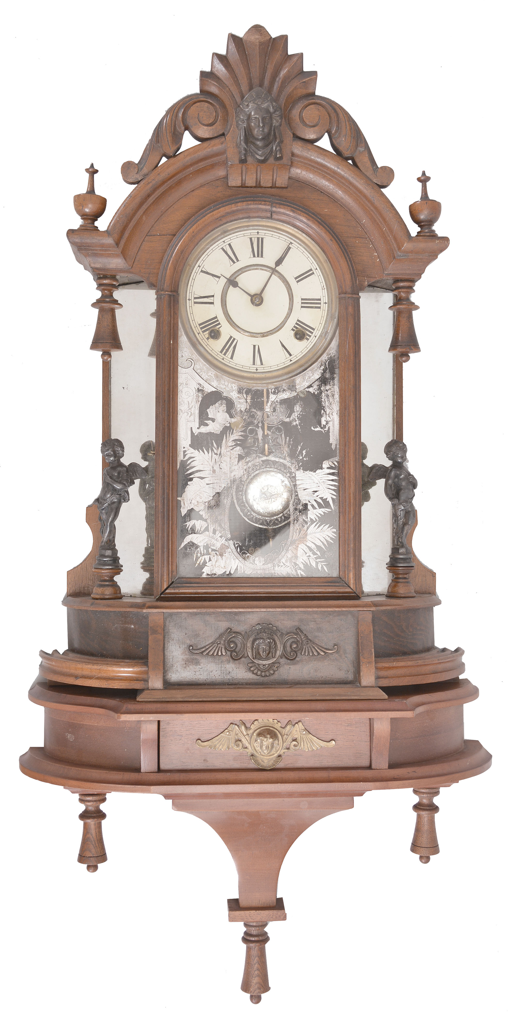 Clocks- 2 (Two): (1) Ansonia Clock Co., New York, "Triumph" mirror-side shelf clock, 8 day, time and strike, spring driven movement in a walnut case with modern shelf matching the clock's base, c1890; (2) New Haven Clock Co., New Haven, Conn., "Vistula" parlor clock, 8 day, time and strike, spring driven movement in a walnut case with painted metal dial, c1885. — Antique Clocks Price Guide