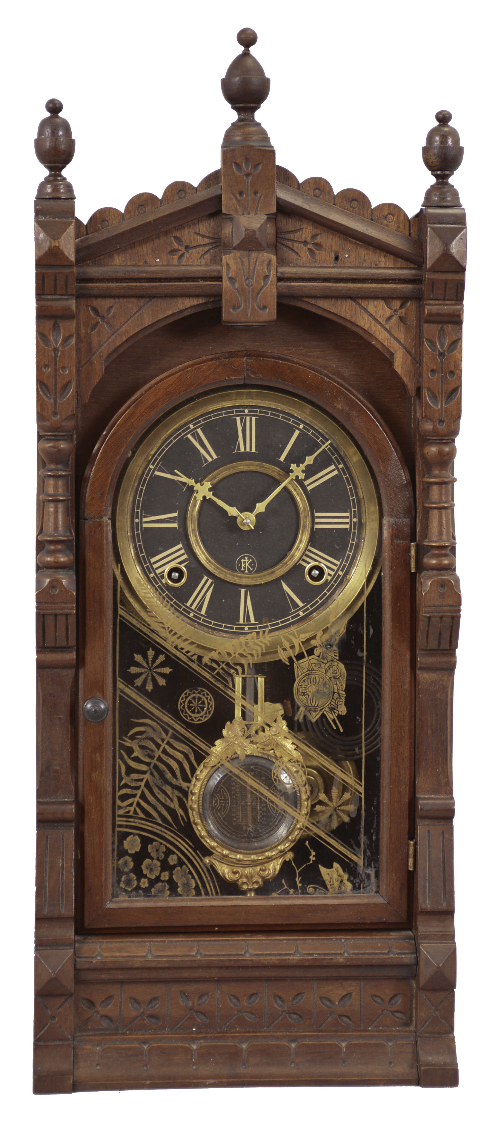 F. Kroeber Clock Co., New York, "Langtry" mantel clock, 8 day, time and strike, spring driven movement in a walnut case with turned side columns and finials, six inch black dial, and Kroeber's patented pendulum. — Antique Clocks Price Guide