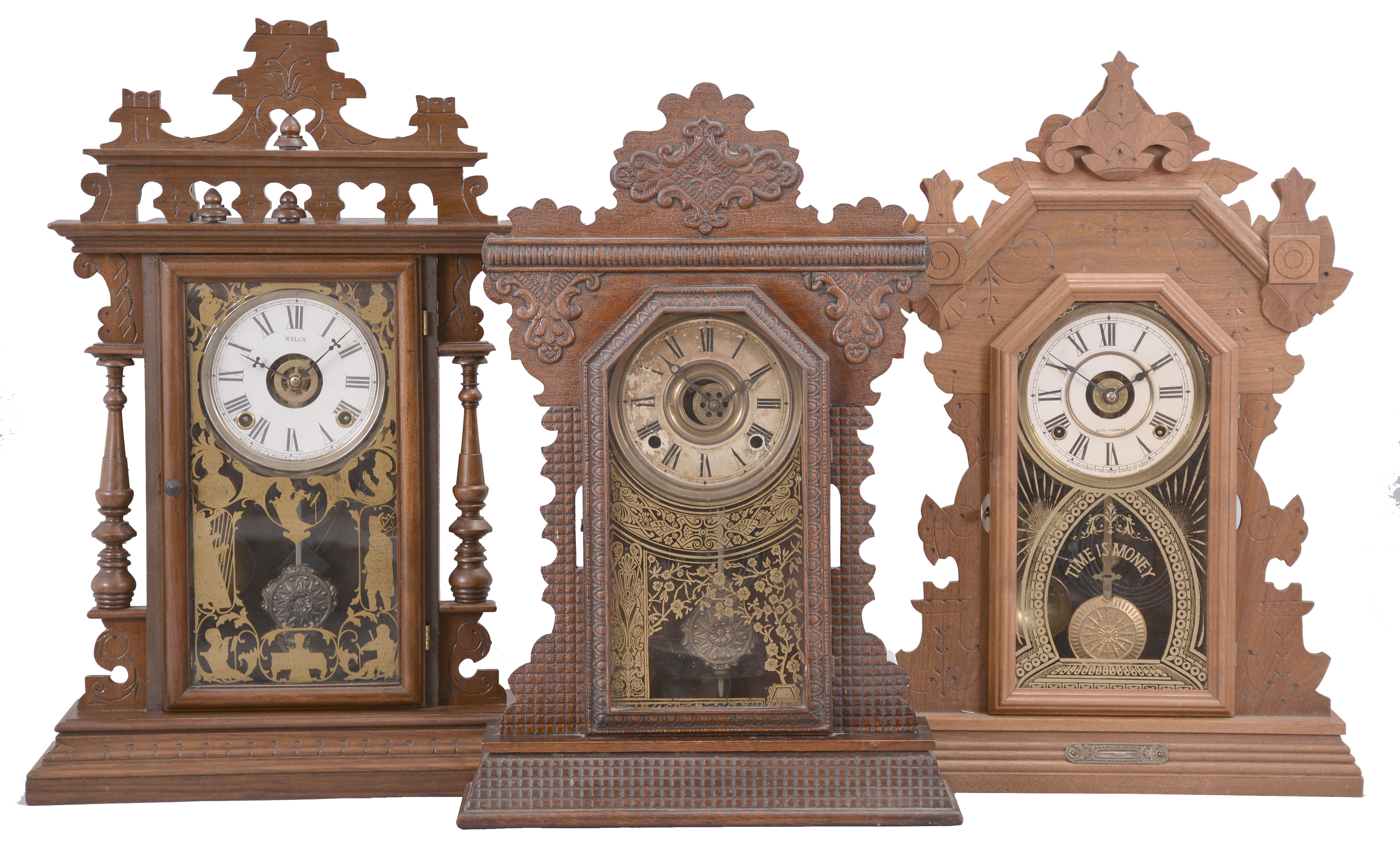 Clocks- 3 (Three): (1) E. N. Welch, "Gounod" mantel clock, 8 day, time and strike with alarm, spring driven movement in a black walnut case, c1889; (2) E. Ingraham, "Garnet" mantel clock, 8 day, time and strike with alarm, spring driven movement in an oak case, c1895; (3) Seth Thomas Clock Co., "Harvard" mantel clock variant, 8 day, time and strike with alarm, spring driven movement in a walnut case, c1893. — Antique Clocks Price Guide
