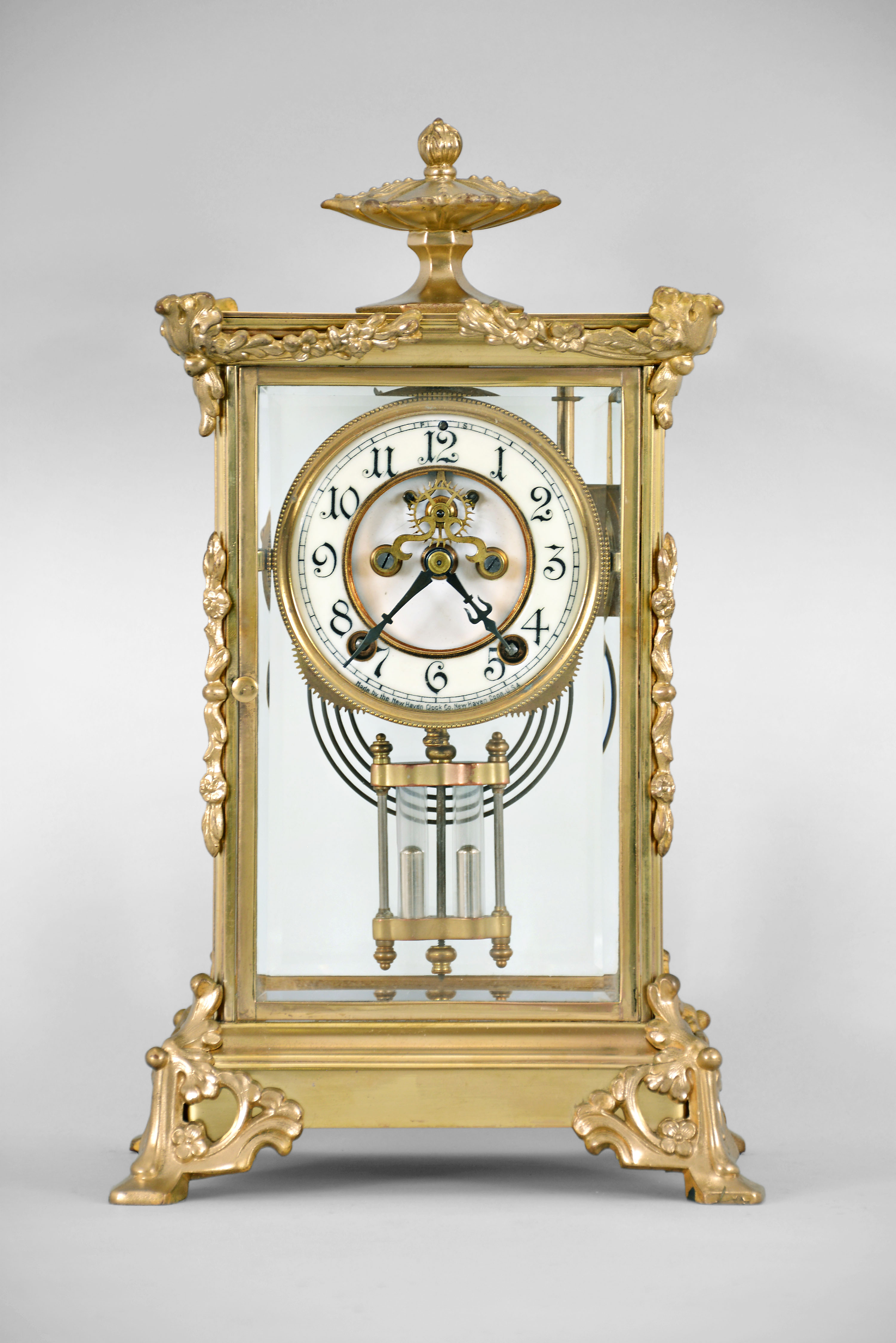 New Haven Clock Co., New Haven, Conn., "Tecumseh", 8 day, time and strike spring brass movement crystal regulator mantel clock. — Antique Clocks Price Guide