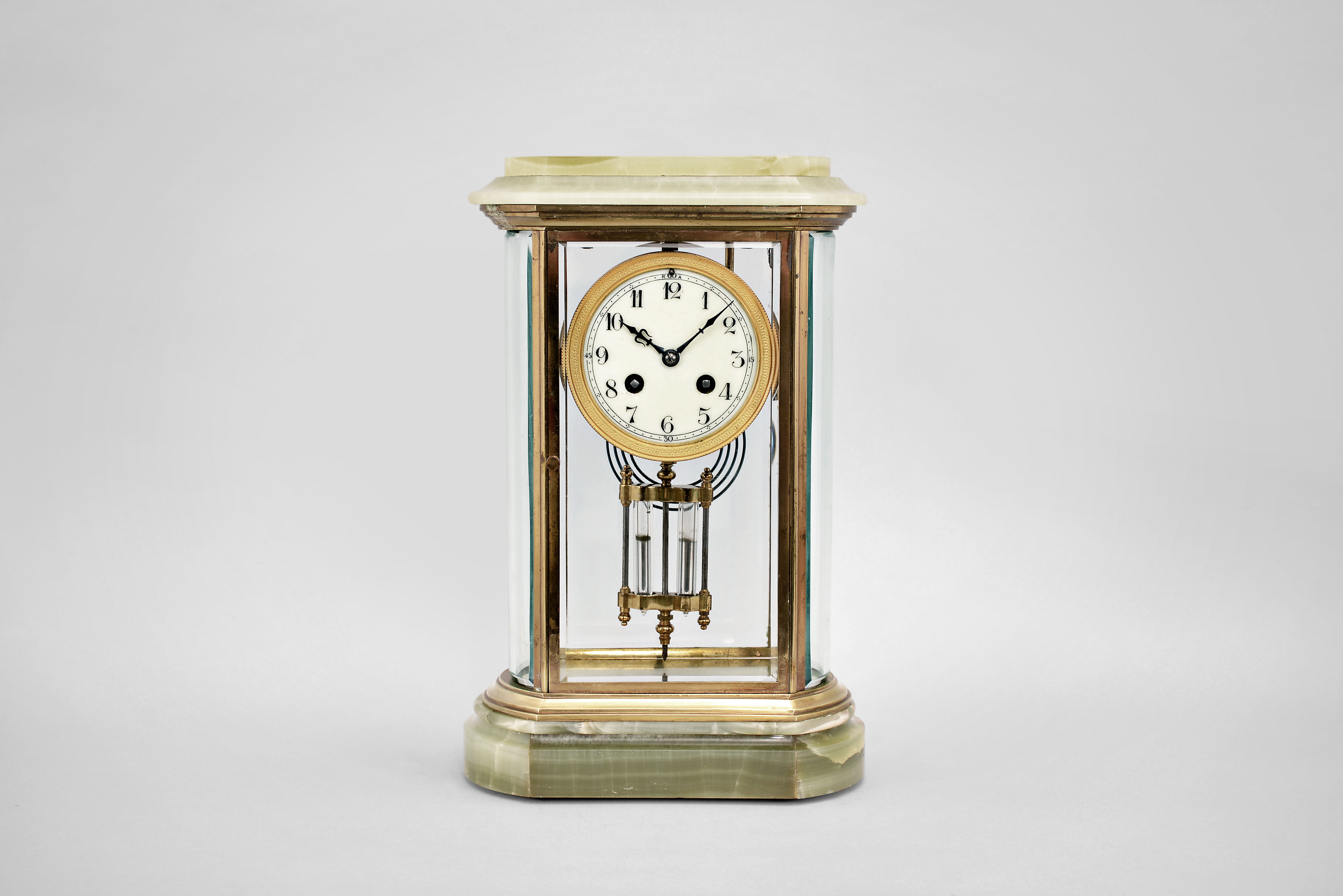 Japy Freres &amp; Cie, Paris, crystal regulator, 8 day, time and strike, spring driven pendule de Paris movement with compensating pendulum in a green onyx case with flat beveled glasses front and back and curved beveled glass on both sides, gilt bezel holding a porcelain dial with numerals, blued steel hands. — Antique Clocks Price Guide