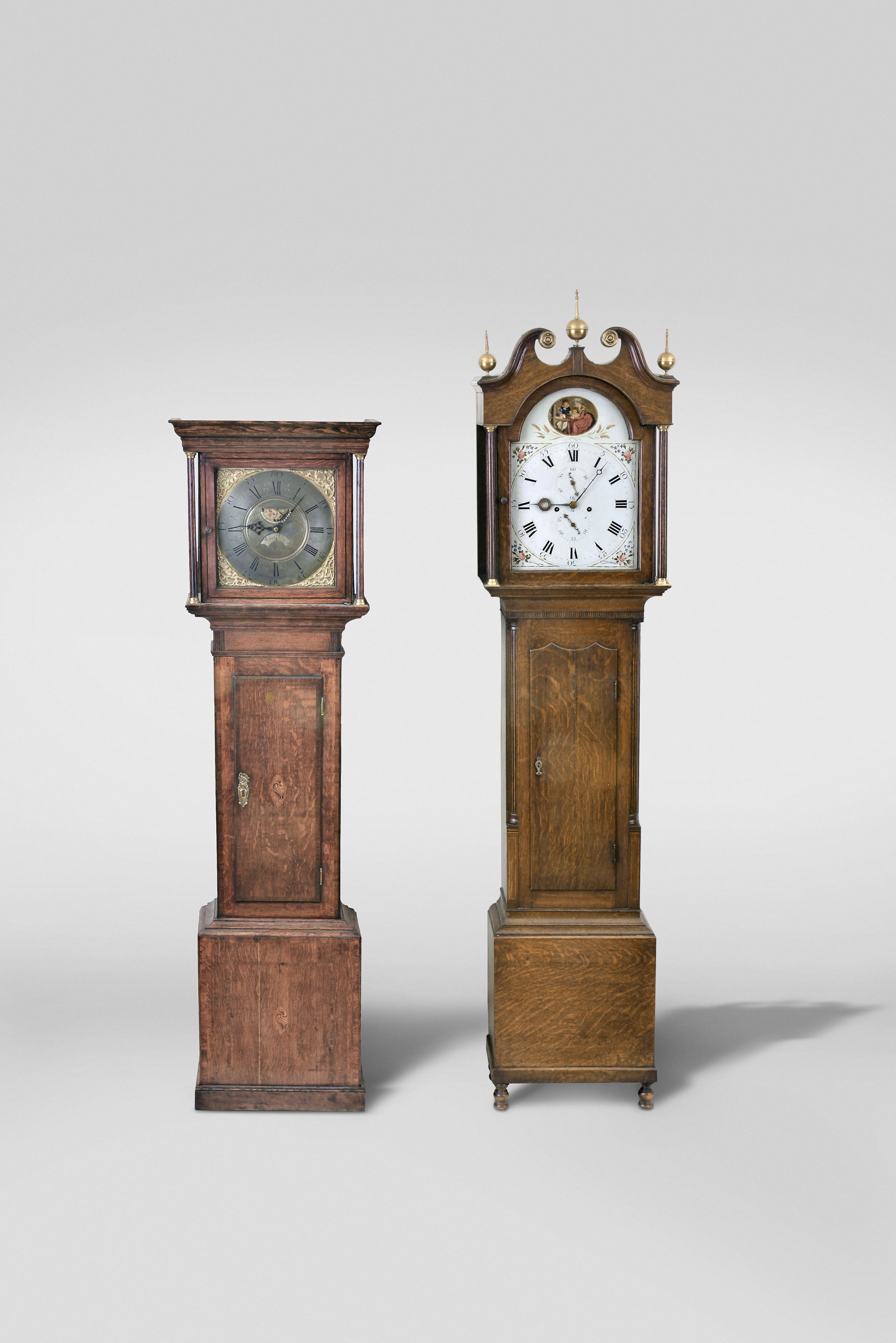 Tall Clocks- 2 (Two) English &amp; Scottish: (1) Thomas Lister, Halifax, Yorkshire, 30 hour, time and strike, weight driven movement in an oak case with flat top and square brass dial with moon phase and calendar, c. 1780; (2) 8 day, time and strike weight driven movement in an oak case with broken arch top and three brass finials, painted metal dial and unique hands, hour hand signed Thonas Blackwood, Bridgend, Perth, Scotland, c. 1810. — Antique Clocks Price Guide