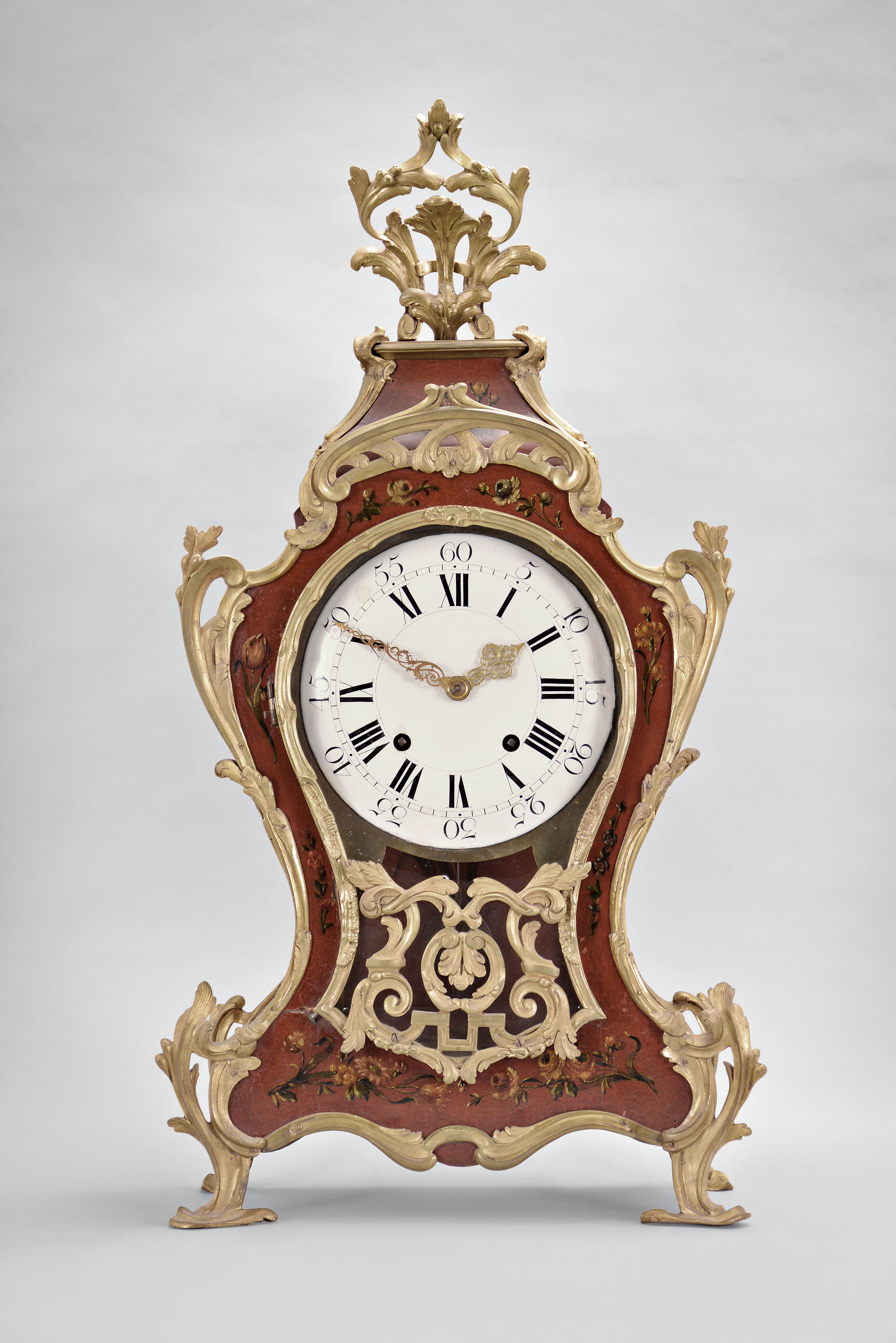 Pierre Le Doux, a Paris, a large, early 20th century reproduction of a Louis XV bracket clock, with 18th century movement, the red hardwood case and bracket with polychrome floral ornament, the bracket with landscape scene featuring a dog at the base of a tree and looking at a bird, and mounted with cast, chased brass naturalistic ornament, roman numeral concave/ convex white enamel dial, pierced and engraved gilt hands, signed brass movement with five baluster pillars and of at least two week duration, with recoil escapement, count wheel striking, and silk thread suspension — Antique Clocks Price Guide