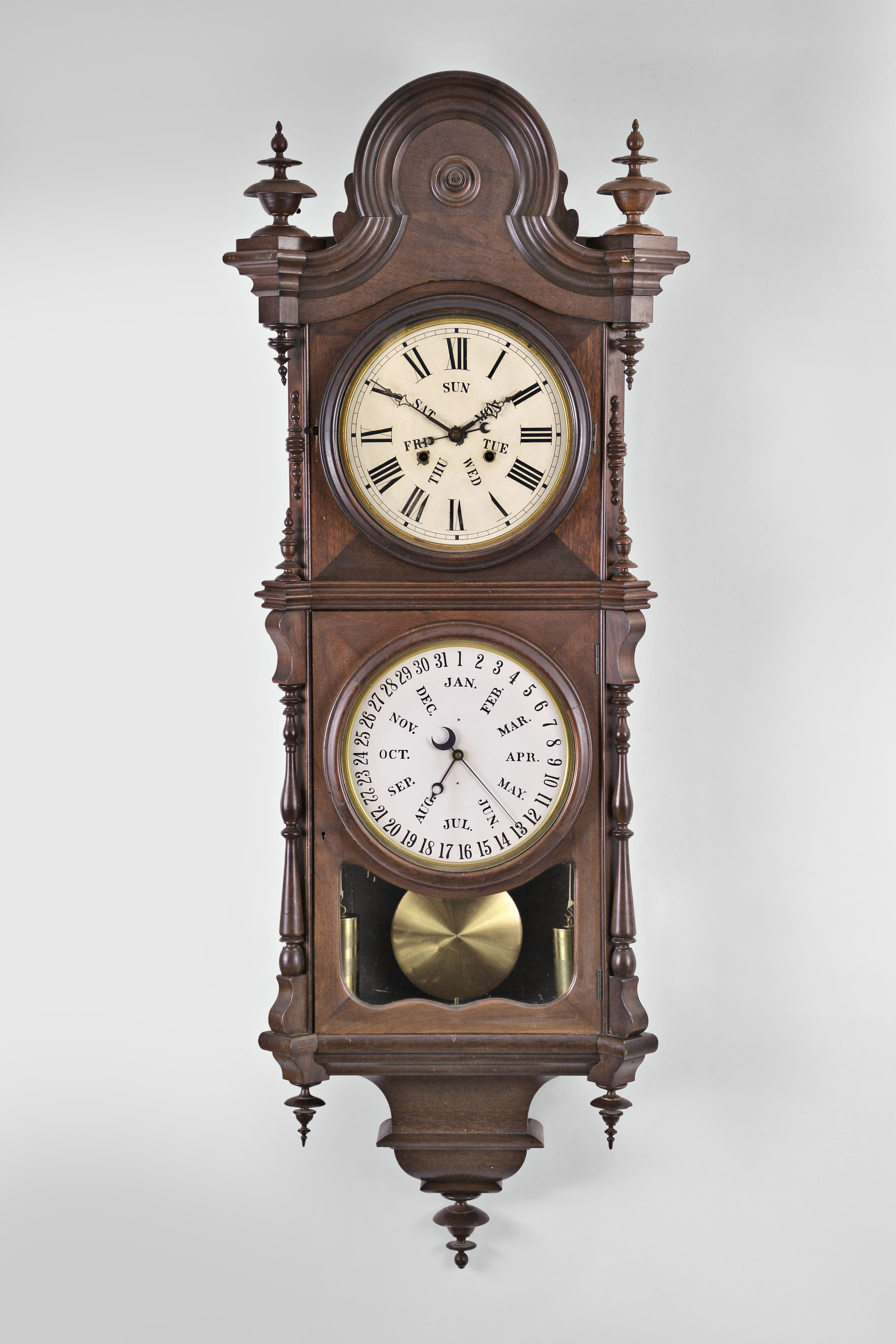 Welch, Spring &amp; Co., Forestville, Conn., "No. 3 Regulator B. W." hanging clock with a double weight driven 8 day timepiece movement and a B. B. Lewis patented perpetual calendar mechanism in a black walnut case. — Antique Clocks Price Guide