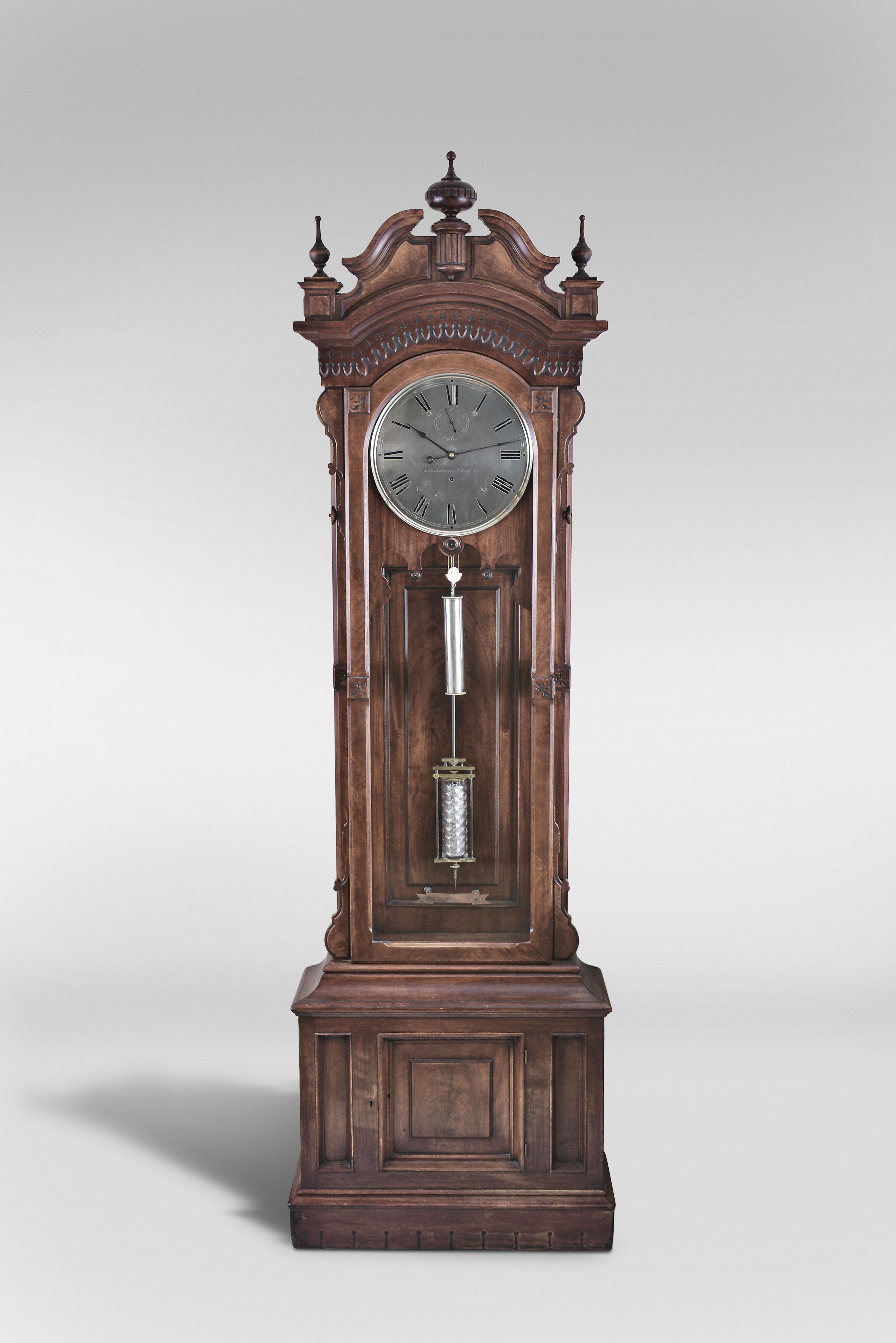 Seth Thomas Clock Co., Thomaston, Conn, "Regulator No. 15", standing jeweler's regulator, 8 day, time only, nickel plated weight driven movement, mercury pendulum with thumbprint glass jar in walnut case with burl walnut highlights and hinged storage in base with silvered dial and center sweep seconds hand — Antique Clocks Price Guide
