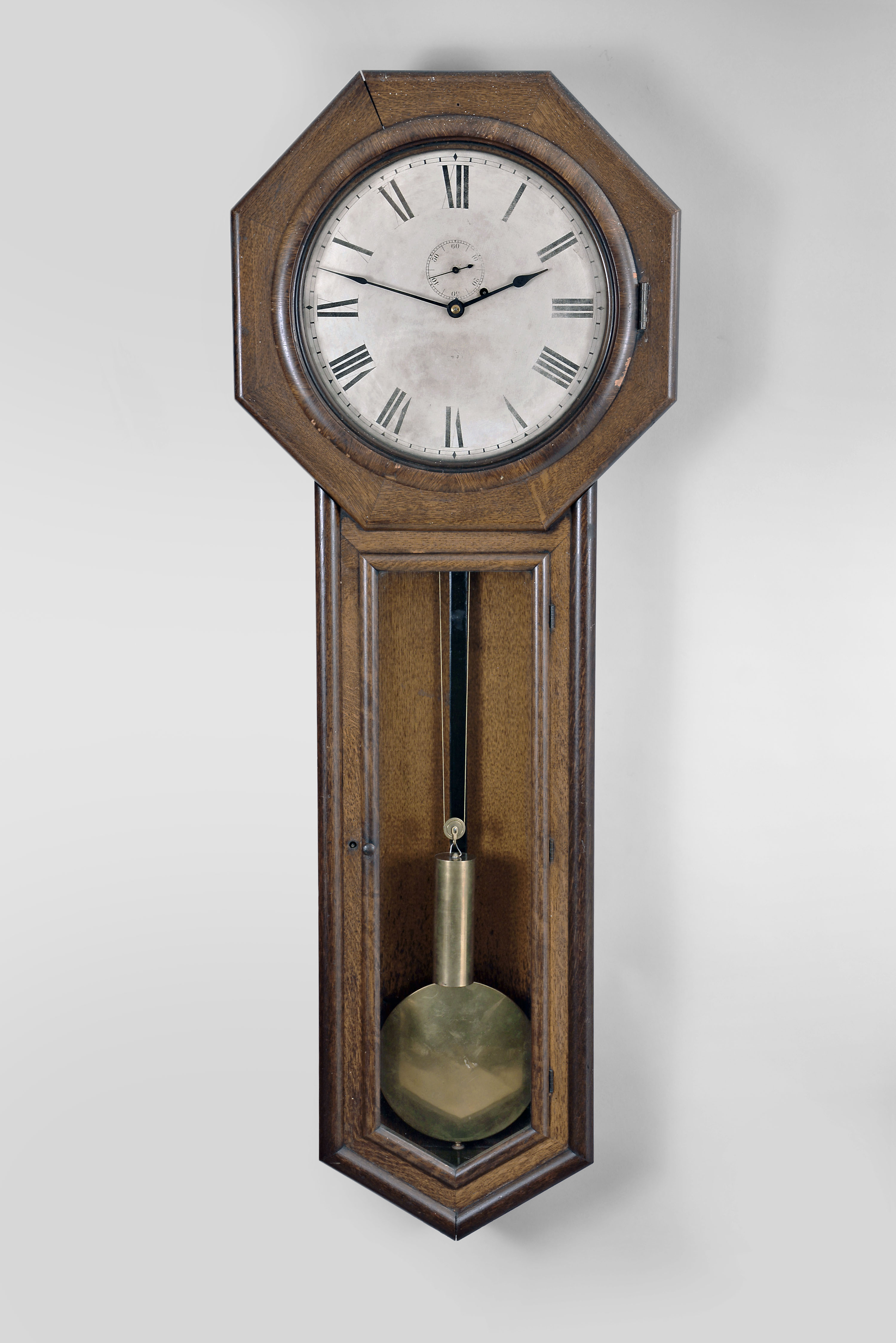 Seth Thomas Clock Co., Thomaston, Conn., "Regulator No. 18" wall hanging clock with a weight driven 8 day timepiece movement with maintaining power in an oak case. — Antique Clocks Price Guide
