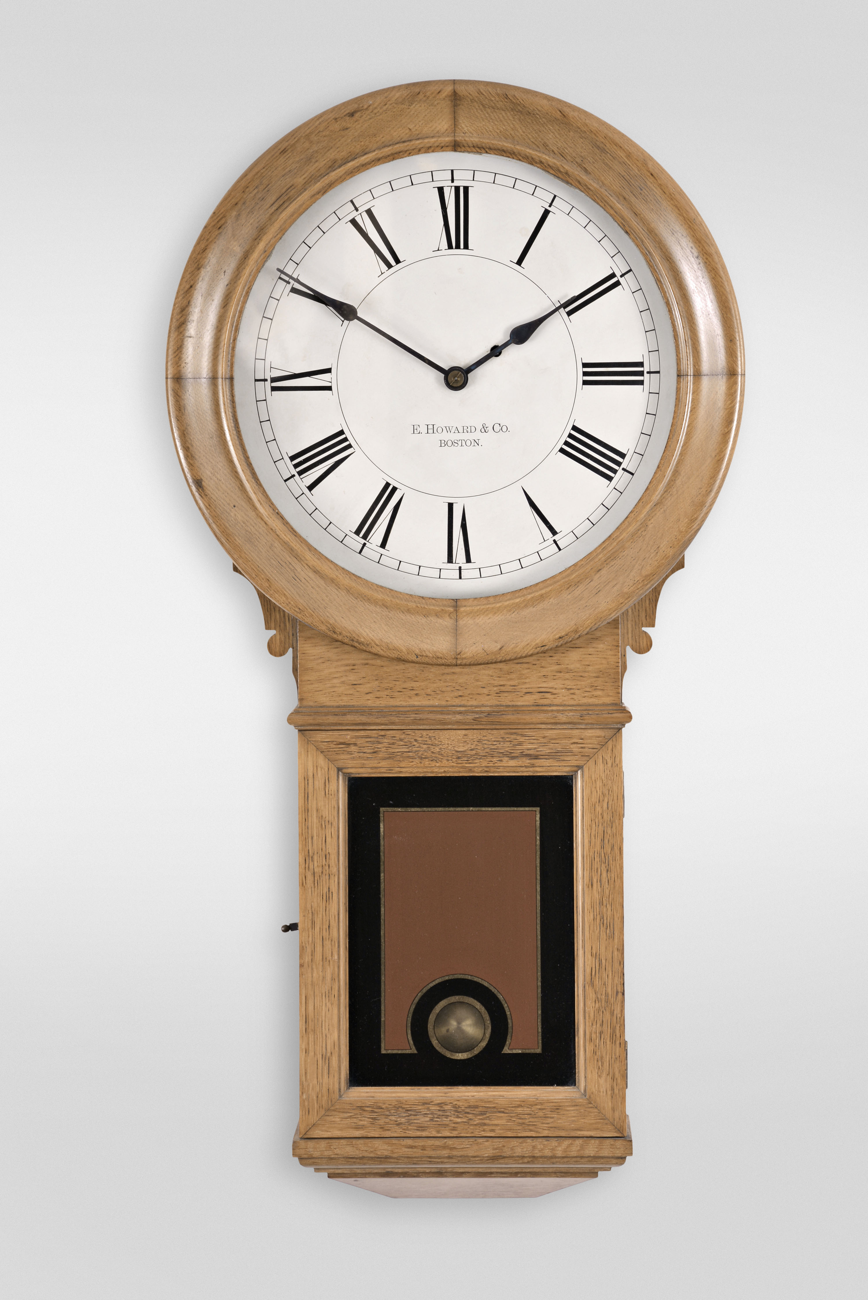 E. Howard &amp; Co., Boston, Mass., "No. 70 Regulator, 14-Inch Dial" wall clock, 8 day, time only, weight driven wall clock in an oak case with painted metal dial and reverse painted lower tablet — Antique Clocks Price Guide