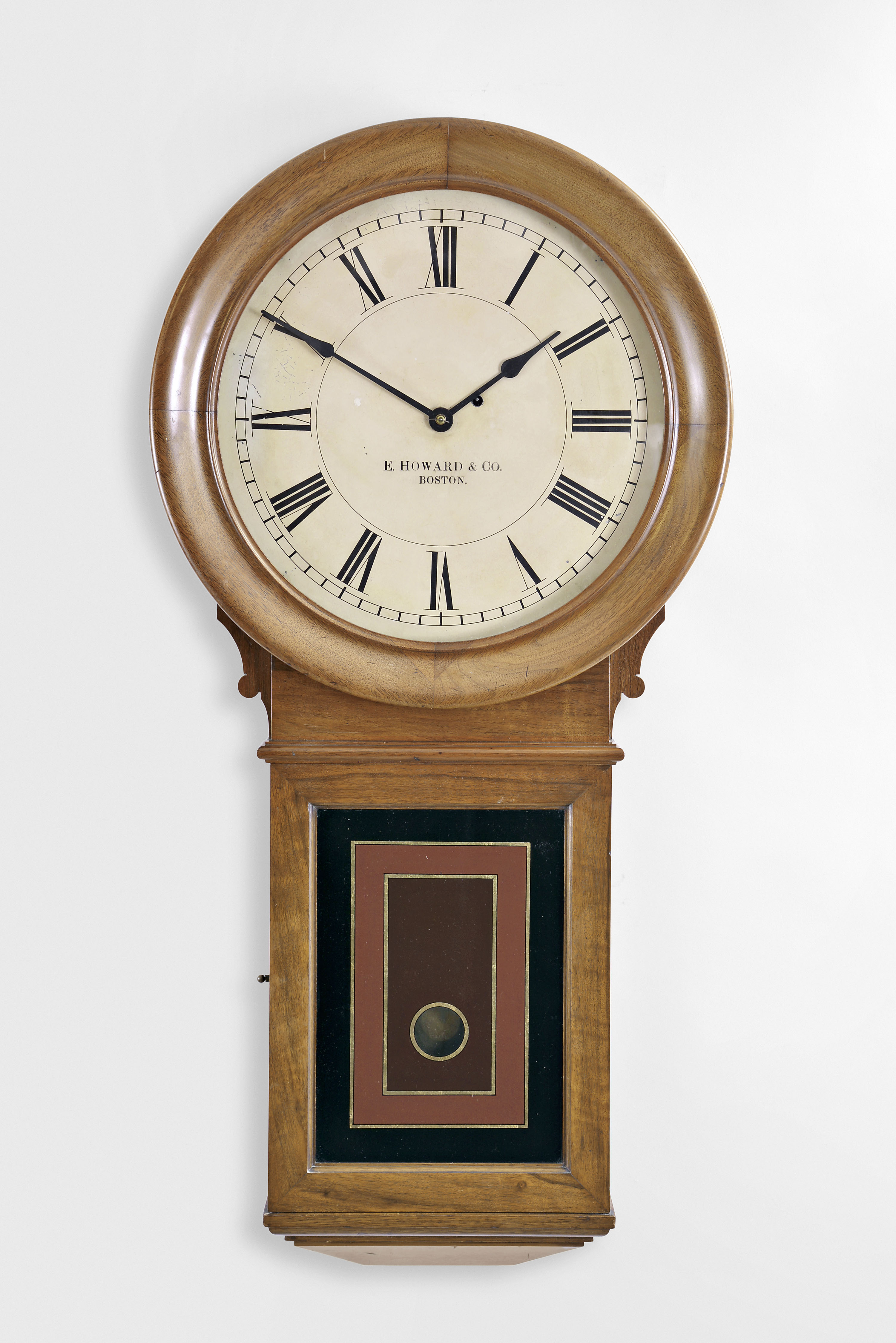 E. Howard &amp; Co., Boston, Mass., "No. 70 Regulator- 16 "- 16" dial wall clock, 8 day, time only, weight driven movement in a walnut case with painted metal dial and reverse painted lower tablet — Antique Clocks Price Guide