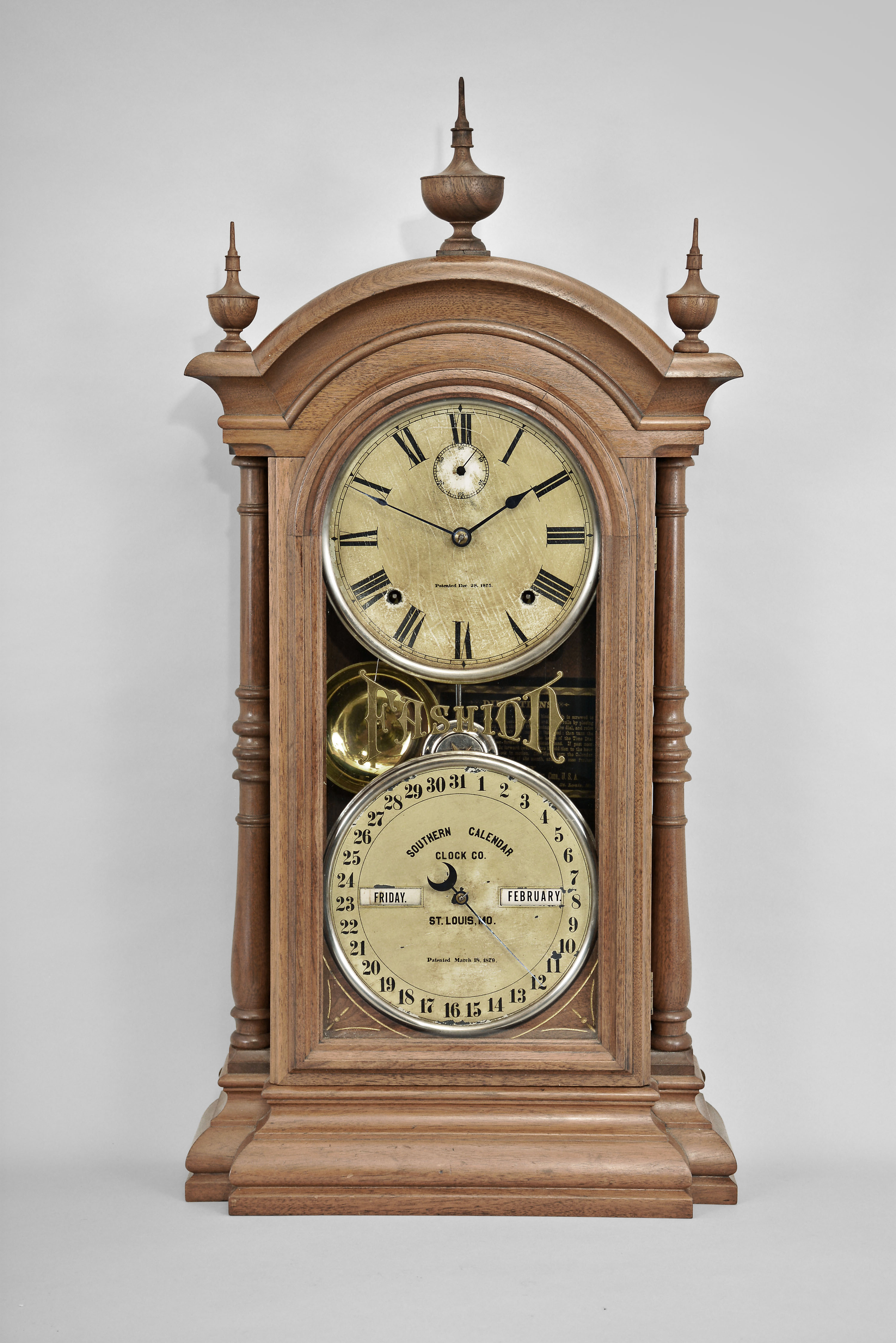 Southern Calendar Clock Co., St. Louis, Mo., "Fashion No. 3" shelf clock with a Seth Thomas spring driven, 8 day, time and strike movement and a R. T. Andrews perpetual calendar mechanism in a walnut case. — Antique Clocks Price Guide