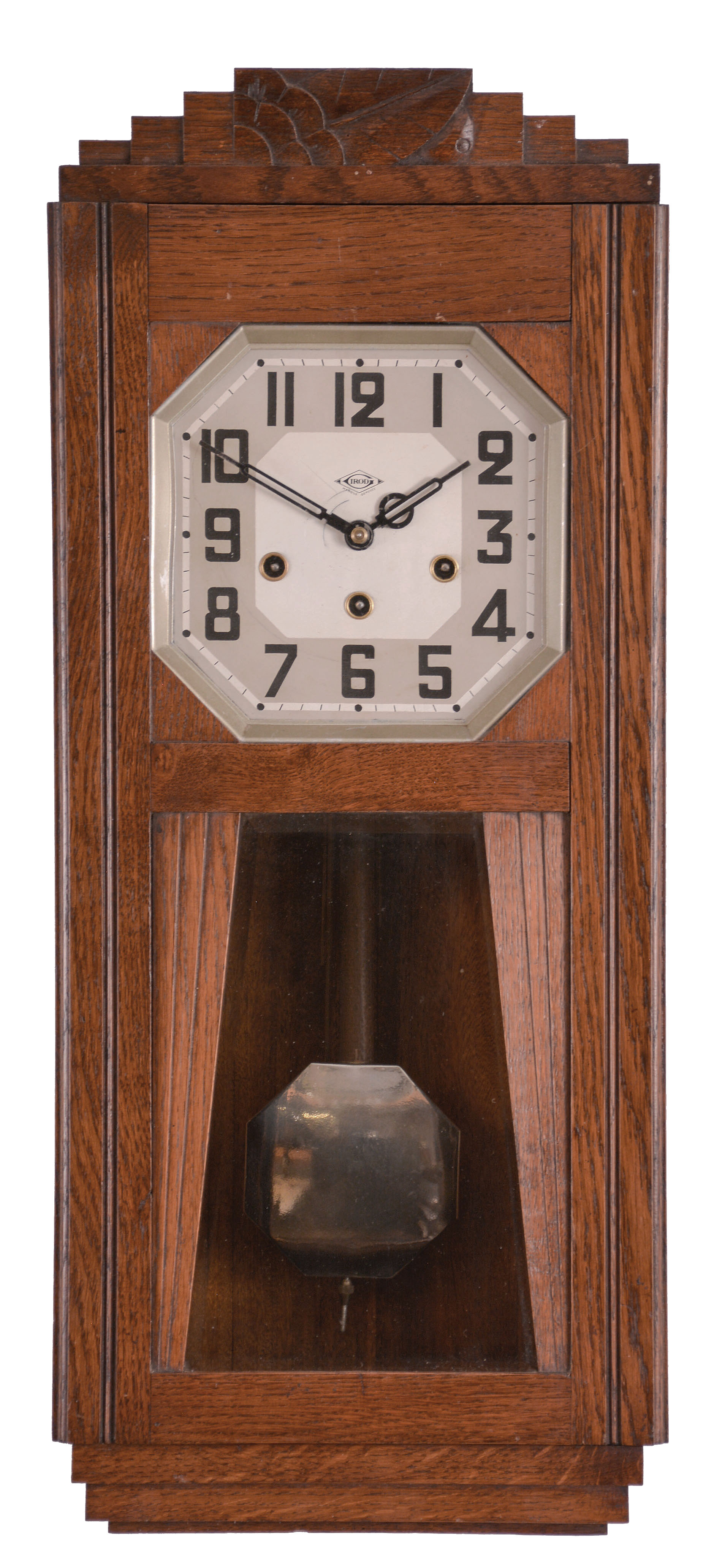 Clock- 2 (Two) German wall: (1) Fabrication Girod, Morbier, France, box clock, 8 day, time and strike with Westminster chime, spring driven movement in an oak case with silvered dial and octagonal pendulum, c1930; (2) Gebruder Junghans AG, Schramberg, Germany, box clock, 8 day, time and strike with Westminster chime, spring drive movement in an oak case with silvered dial, c1925. — Antique Clocks Price Guide