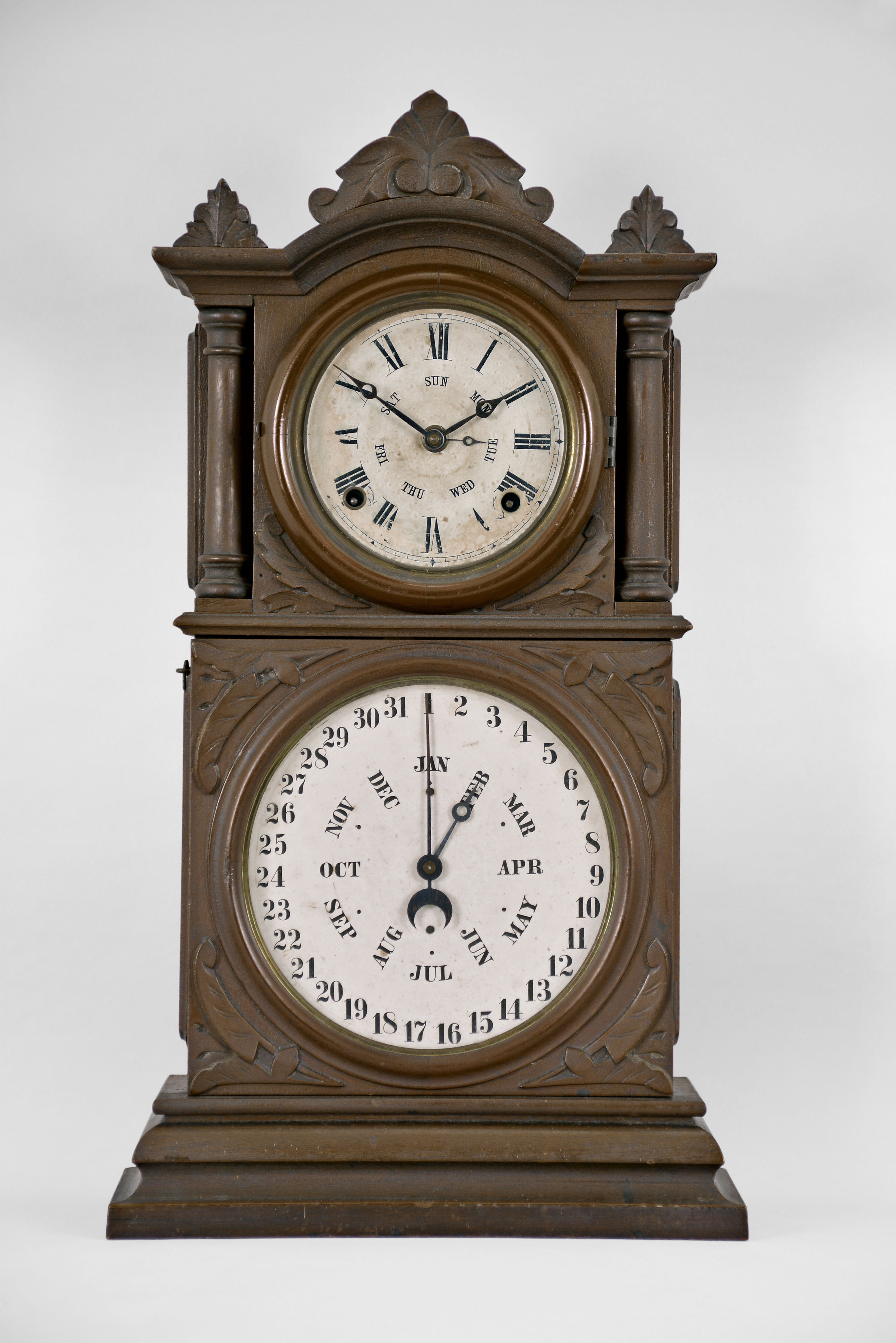 E. Ingraham &amp; Co., Bristol, Conn., "Ingraham Calendar" shelf clock with a spring driven 8 day time and strike movement with a B. B. Lewis patented perpetual calendar mechanism in a walnut case. — Antique Clocks Price Guide