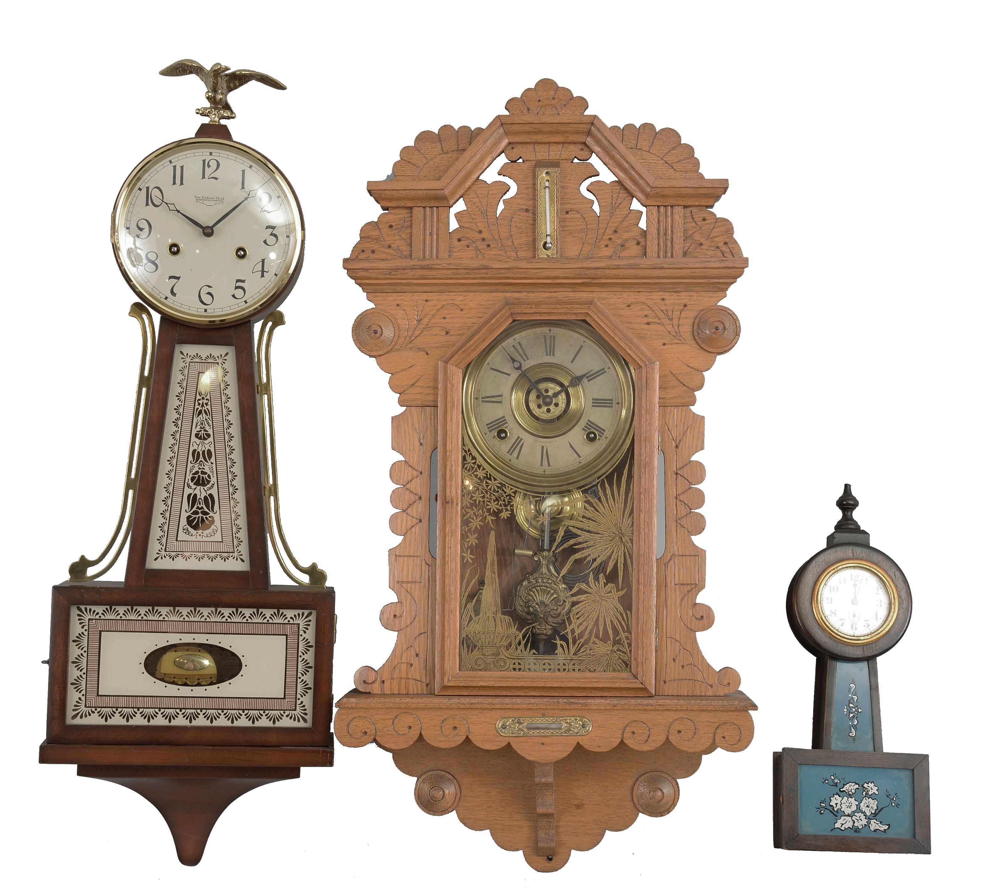 Clocks- 2 (Three) wall: (1) E. Ingraham, Bristol, Conn., "Crown Drop" hanging clock, 8 day, time and strike with alarm, spring driven movement in an oak case with thermometer and spirit level, c1895; (2) Waterbury Clock Co., "Alameda" miniature banjo clock, 30 hour, time only, spring driven balance wheel movement in a wood case with glass tablets, c1913; (3) New England Clock Co., Farmington, Conn., banjo clock, 8 day, time and strike, spring driven movement in a hardwood case, c1975. — Antique Clocks Price Guide