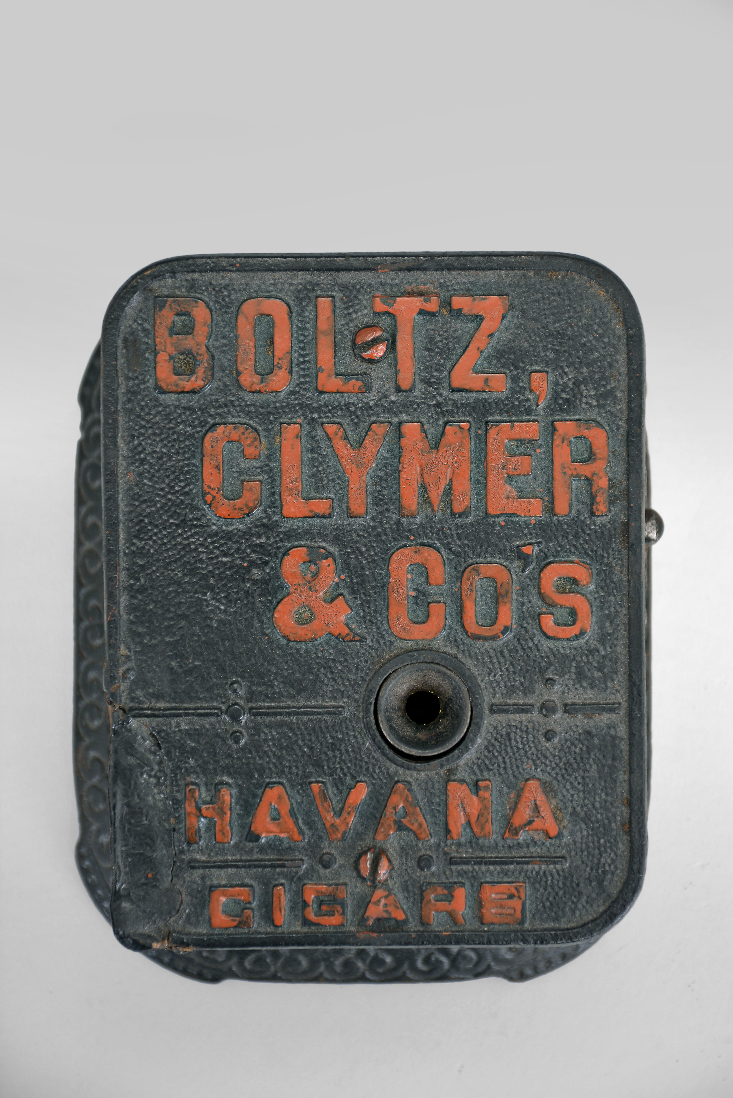 Boltz, Clymer and Co., Philadelphia and San Francisco, countertop cigar trimmer, spring driven cutter in a cast iron case with raised lettering listing the name of the company and "Havana Cigars ". — Antique Clocks Price Guide