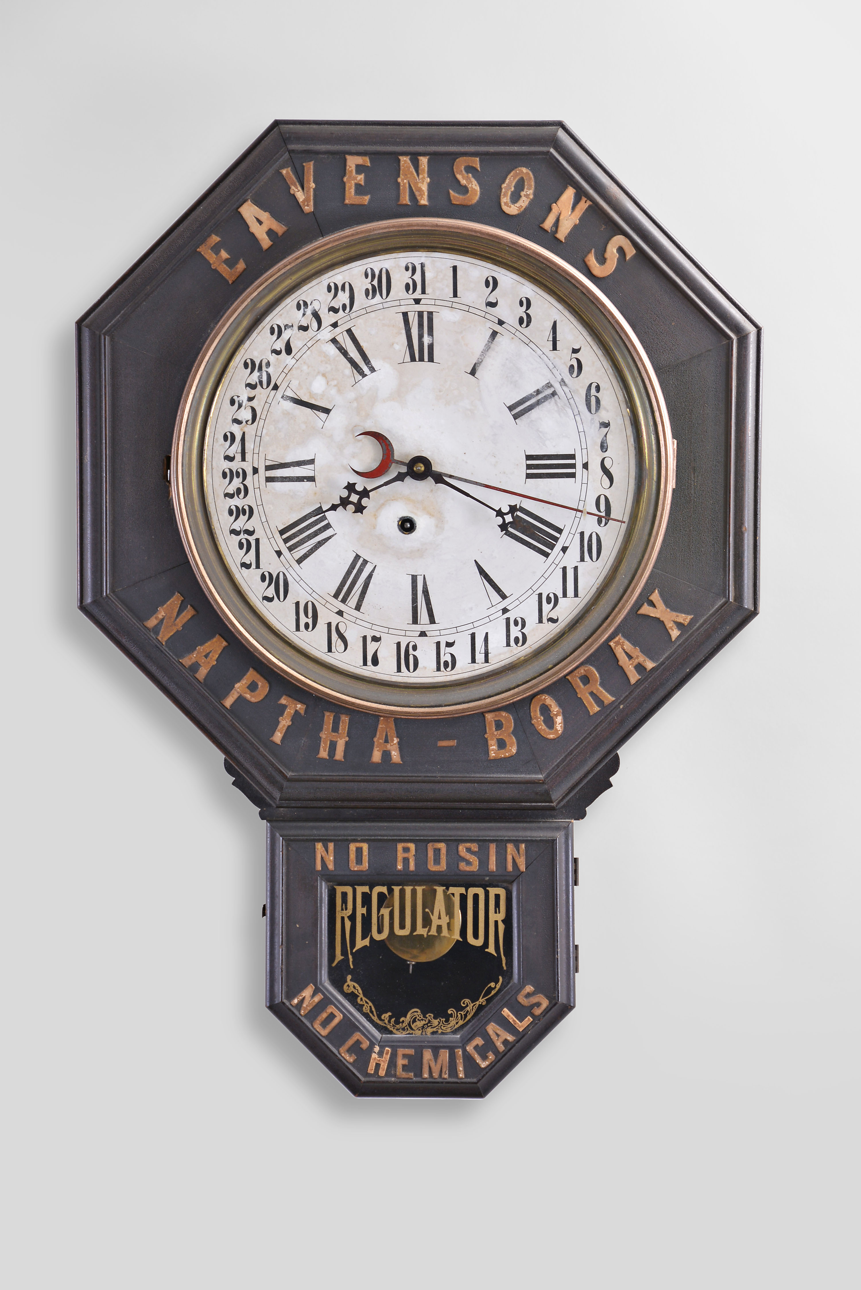 Advertising wall clock, 8 day time and simple calendar, spring driven movement in a cutomized case with advertising for "EAVENSONS NAPTHA-BORAX" with "NO ROSIN NO CHEMICALS" applied around bottom door — Antique Clocks Price Guide