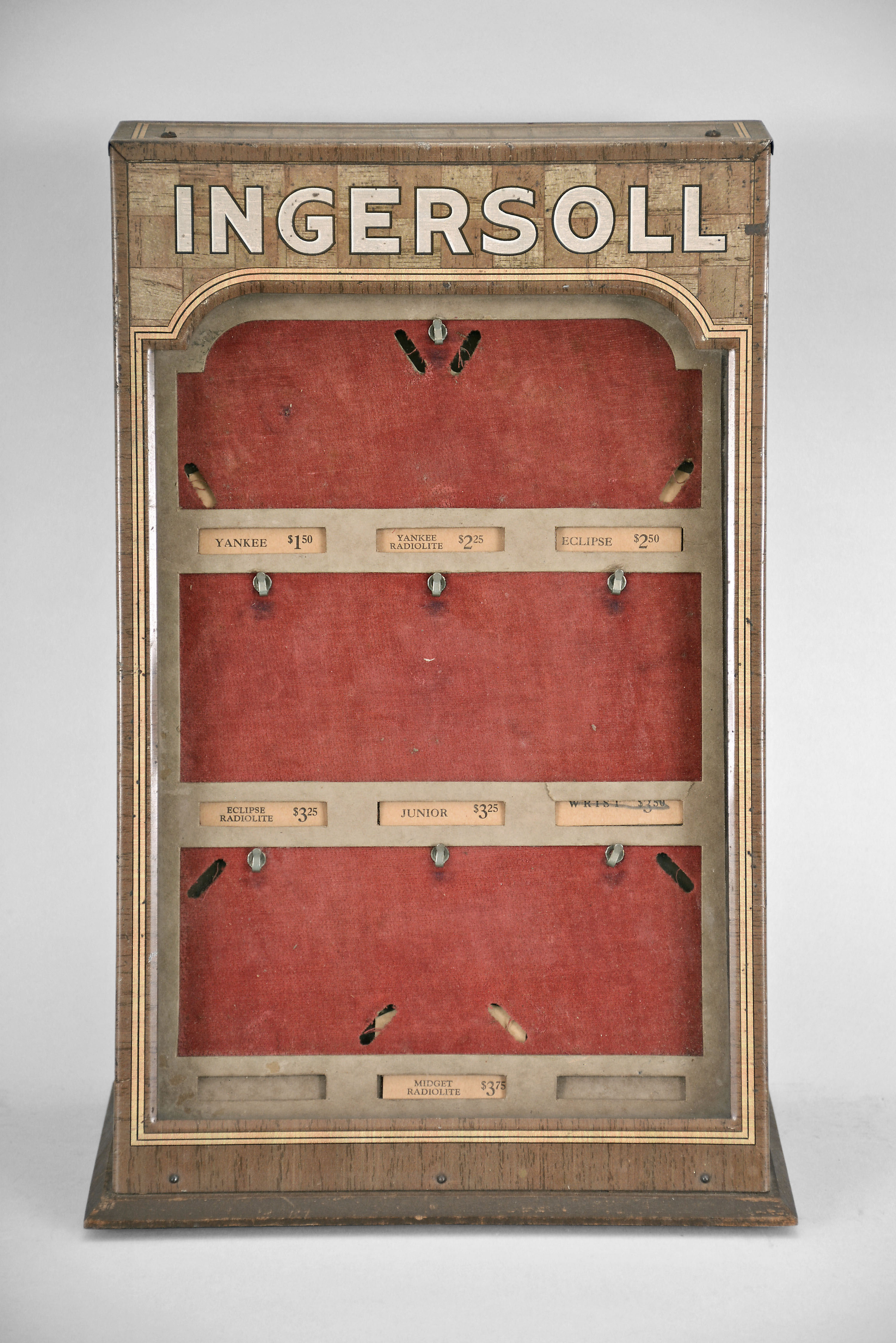 Ingersoll Watch Company countertop display case with prices. Ingersoll watches were supplied by the Waterbury Clock Co. The "Yankee" watch made by Waterbury was introduced in 1896 and sold for one dollar. — Antique Clocks Price Guide