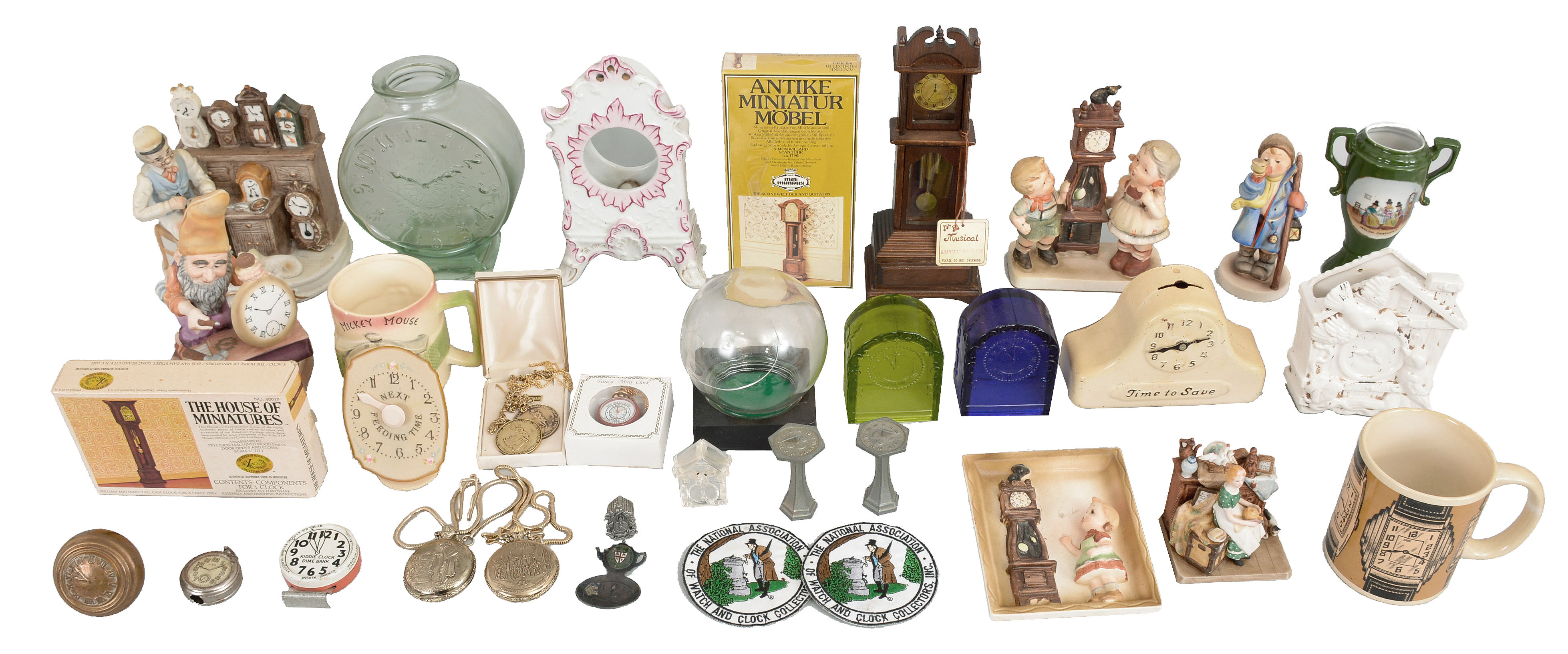 Clocks and Collectibles- Dozens of small clocks and clock-related items including ceramic figures, mugs, glass, banks, and more. Lot also includes 17 Lux pendulette clocks including less common models such as the "Cat", "Dutch Cottage Cuckoo, "Sally Rand Fan Dancer", and "U.S. Capitol with Roosevelt Profile ". — Antique Clocks Price Guide