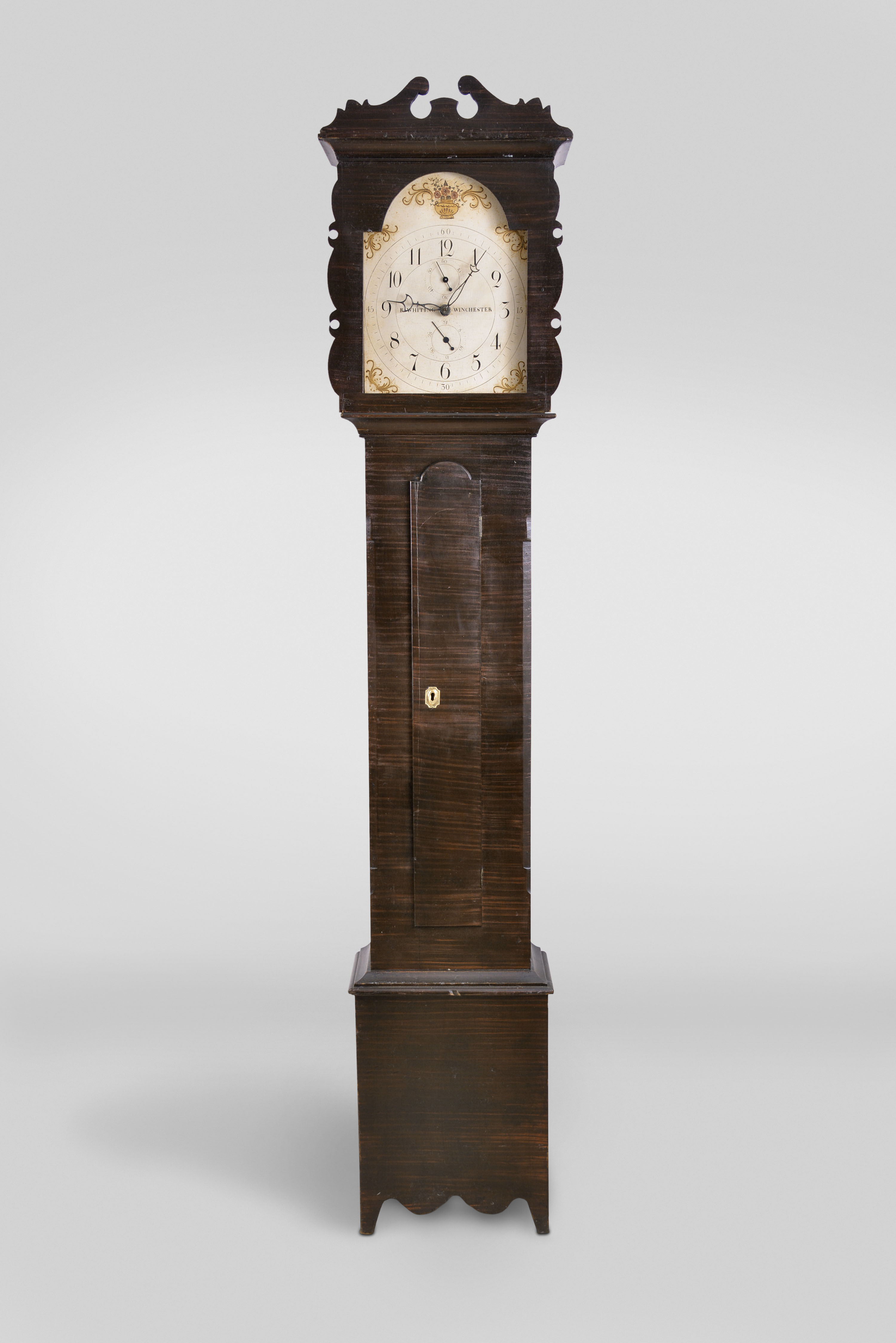 Riley Whiting, Winchester, Conn., tall clock, 30 hour, time, strike and calendar, weight driven wooden works movement in a soft wood case with flame mahogany faux finish and painted wooden dial — Antique Clocks Price Guide