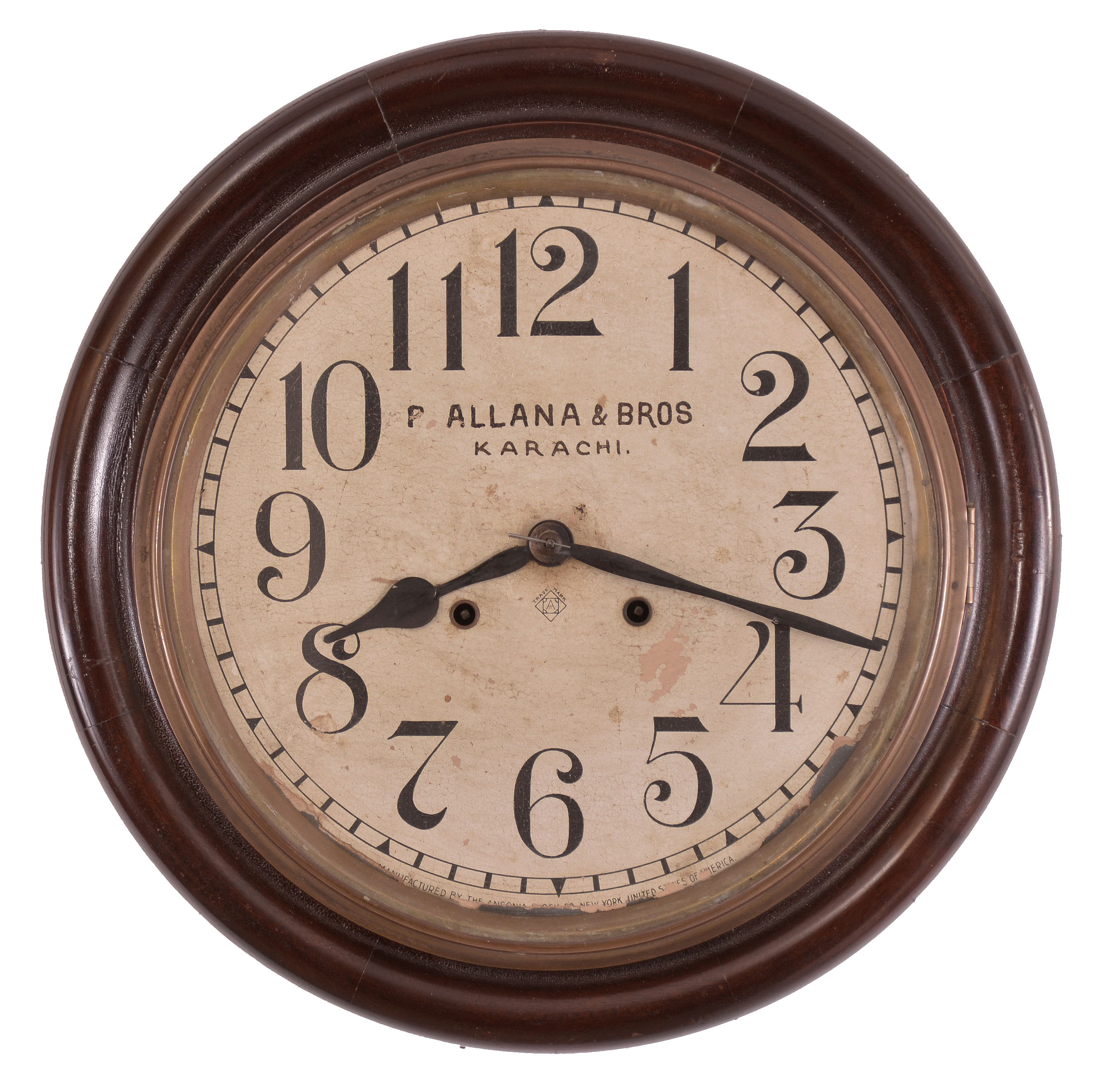 Clocks- 2 (Two): (1) Ansonia Clock Co., New York, "Gresham" wall hanging gallery clock with a 12 inch dial, dial reading "P. Allana &amp; Bros / Karachi." and a spring driven 8 day time and strike movement in a finished mahogany case. c1894. (2) Seth Thomas Clock Co., Thomaston, Conn., "Office No. 5" wall hanging clock with a spring driven 8 day time and strike movement in an oak case. c1904. — Antique Clocks Price Guide