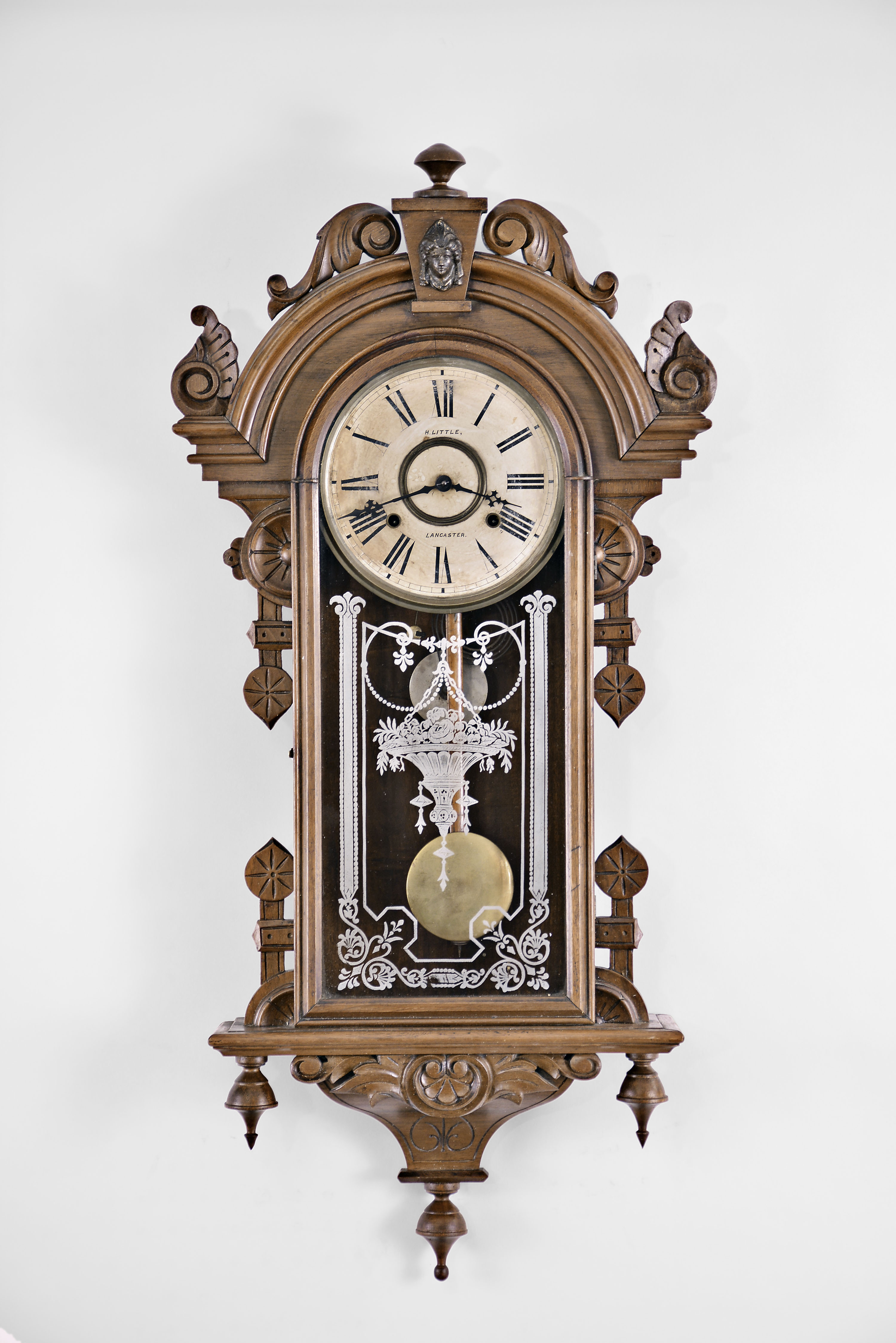 Wm. L. Gilbert Clock Co., Winsted, Conn., "Columbia" wall hanging clock with a spring driven 8 day time and strike (cathedral gong) movement in a walnut case. — Antique Clocks Price Guide
