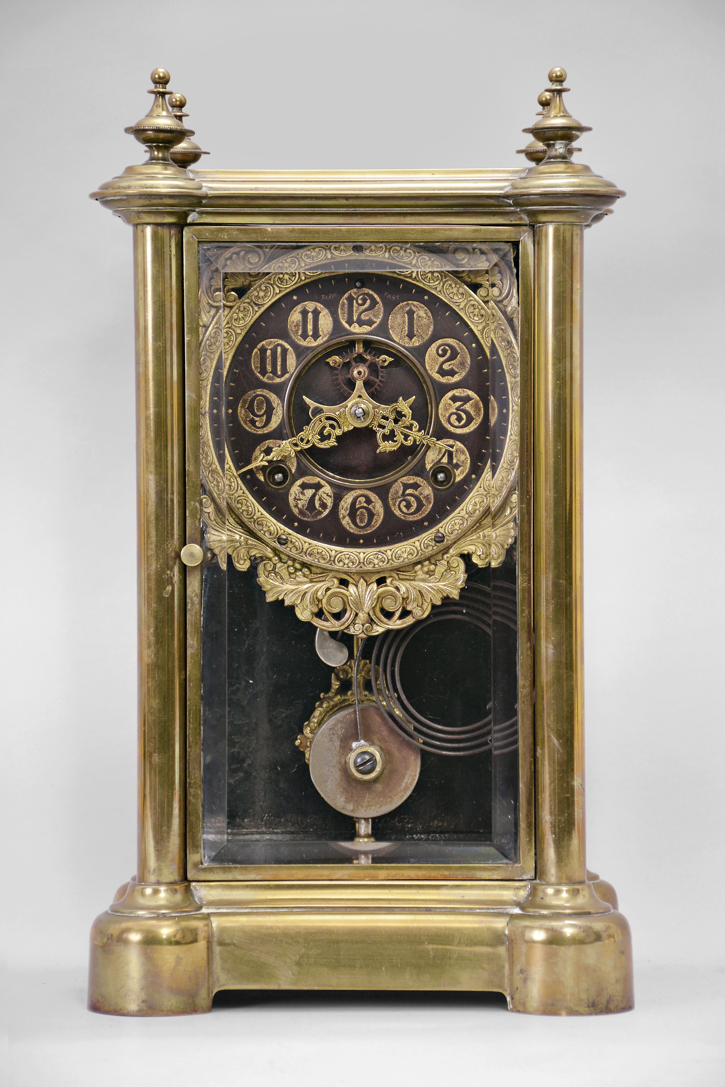 Ansonia Clock Co., New York, "Symbol Extra", 8 day, time and strike spring brass movement crystal regulator shelf clock with black and gilt hard rubber dial. — Antique Clocks Price Guide