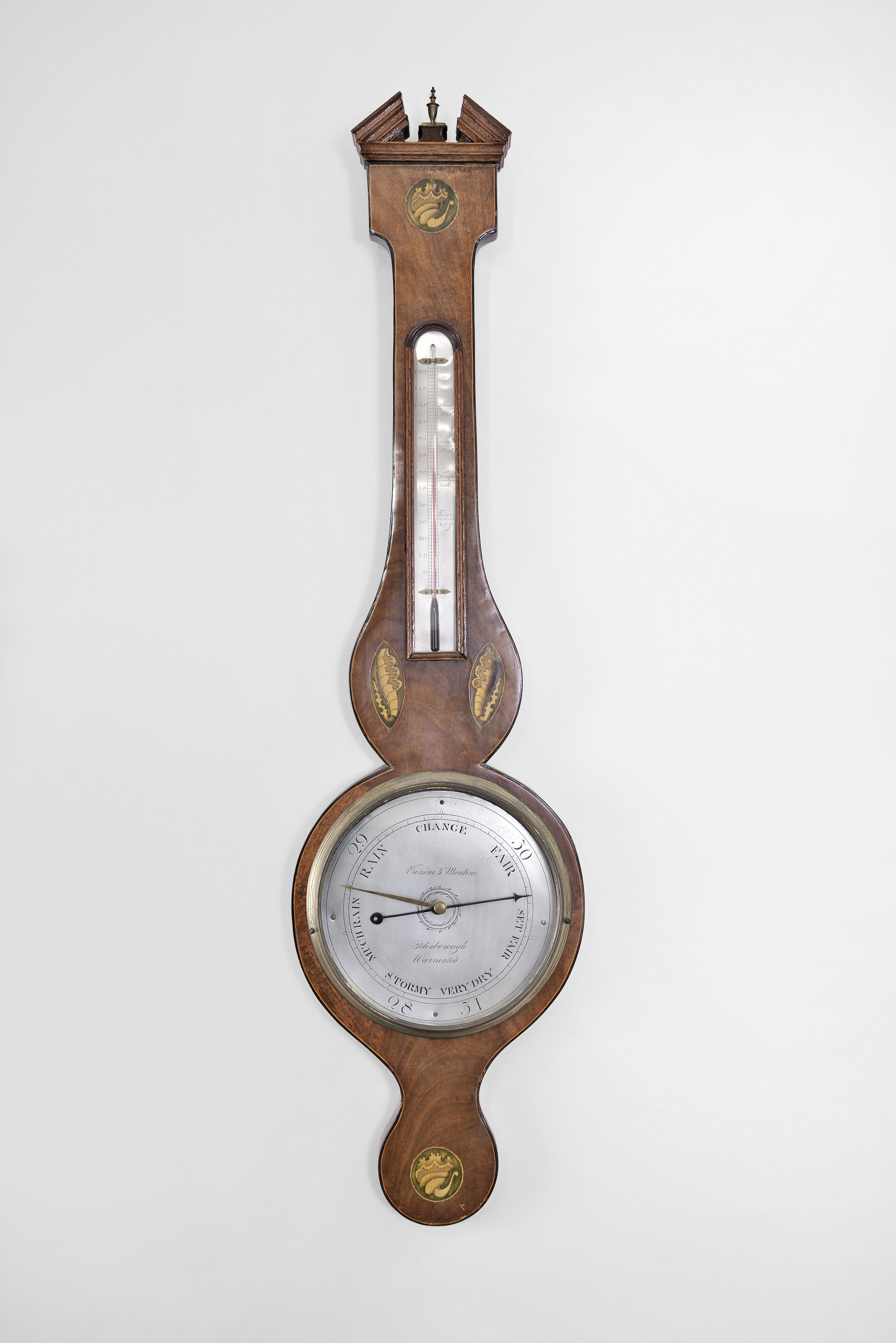 Vanini and Montini, Peterborough, England, wheel or banjo barometer with alcohol thermometer, in an inlaid mahogany veneered case with silvered dial and brass indicator knob. — Antique Clocks Price Guide