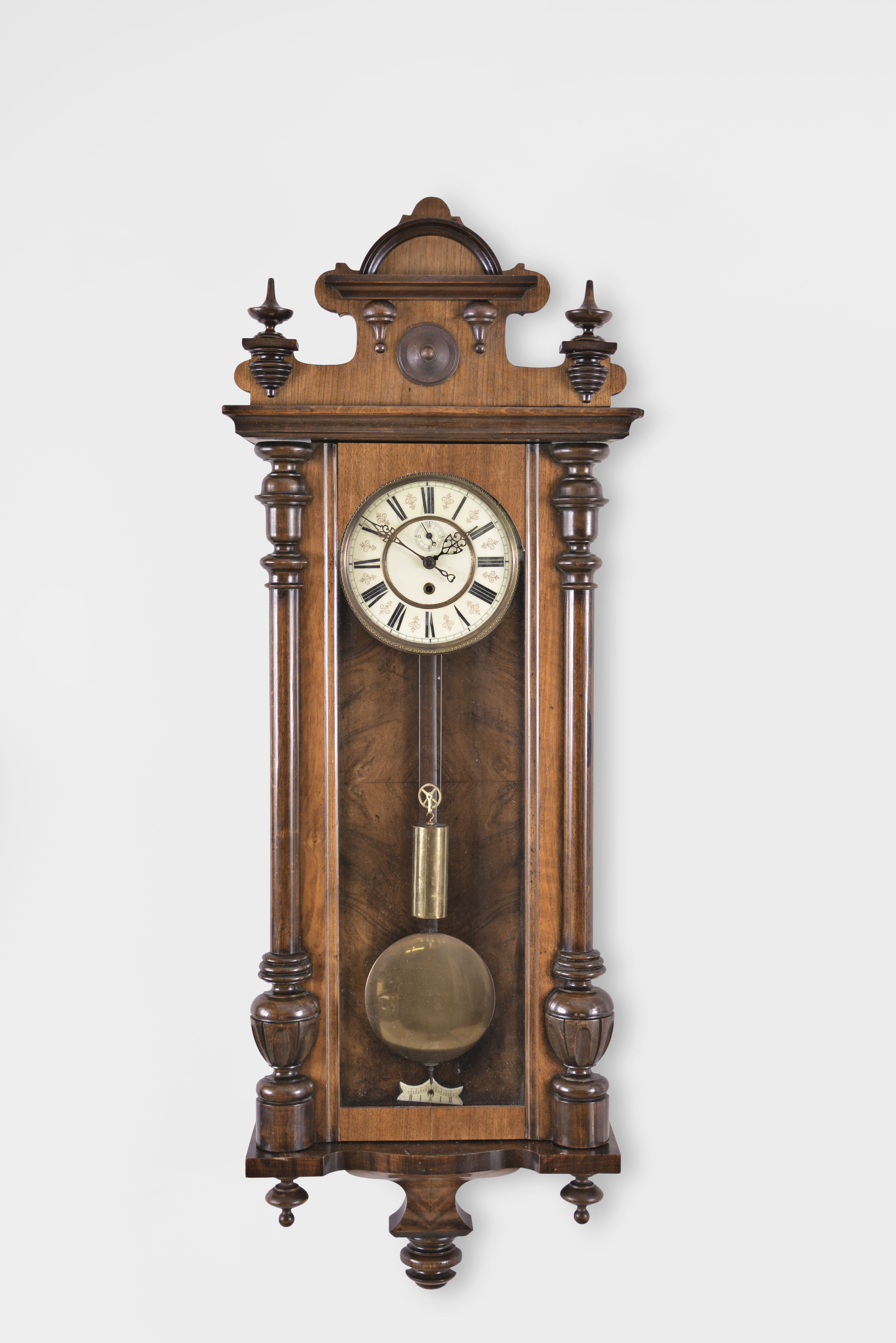 Clocks- 2 (Two): (1) A. Willmann &amp; Co., Freiberg, Germany, Vienna style regulator, 8 day, time only, weight driven movement in a walnut case with cream porcelain dial, c1880; (2) Germany or Austria, Vienna style regulator, 8 day, time only, weight driven movement in walnut veneer case with ebonized accents and two-piece enamel dial, c1885. — Antique Clocks Price Guide