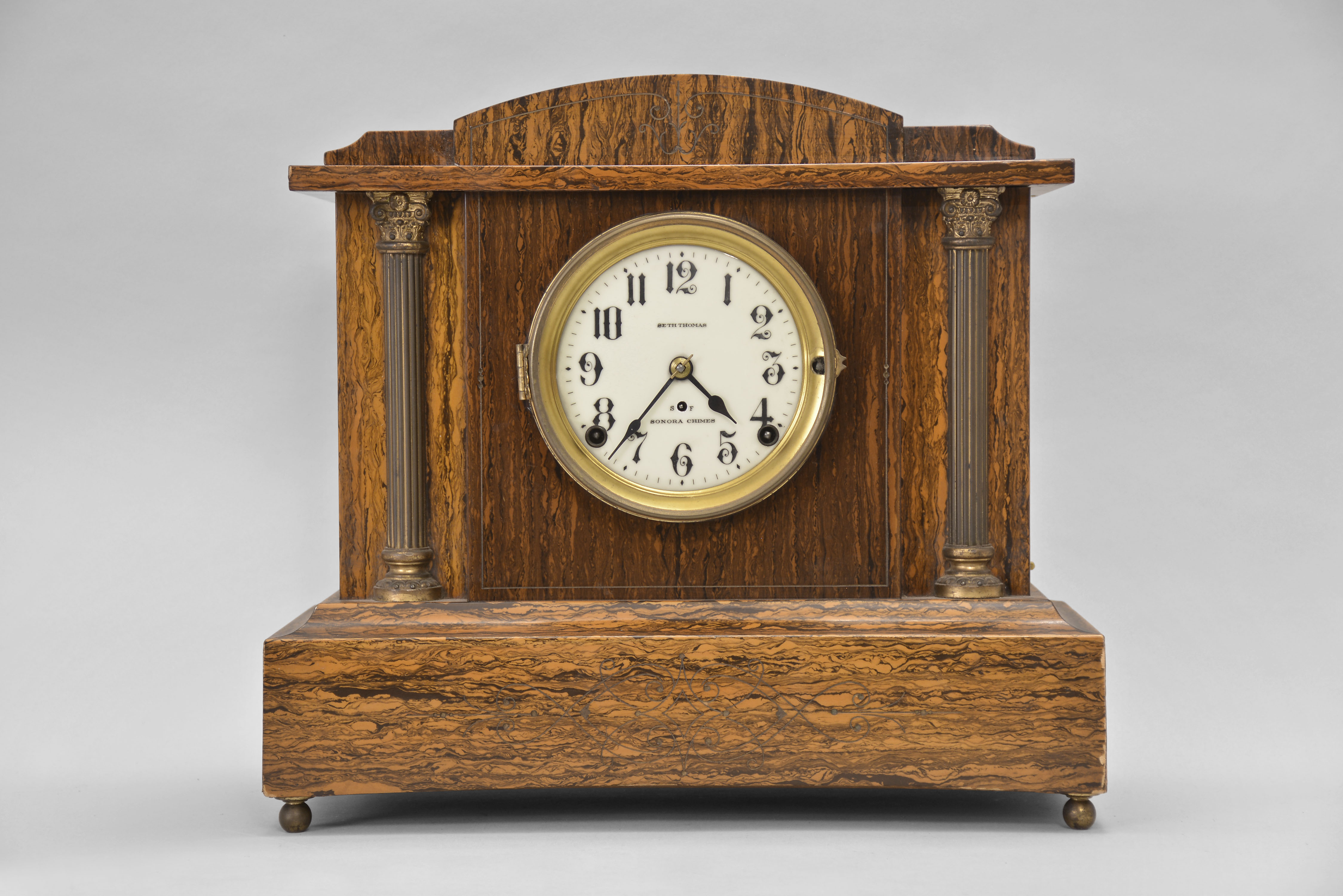 Seth Thomas Clock Co., Thomaston, Conn., "Chime Clock No. 1" shelf clock with a spring driven 8 day time and Sonora strike (4 bell) movement in an adamantine mahogany finished case. — Antique Clocks Price Guide