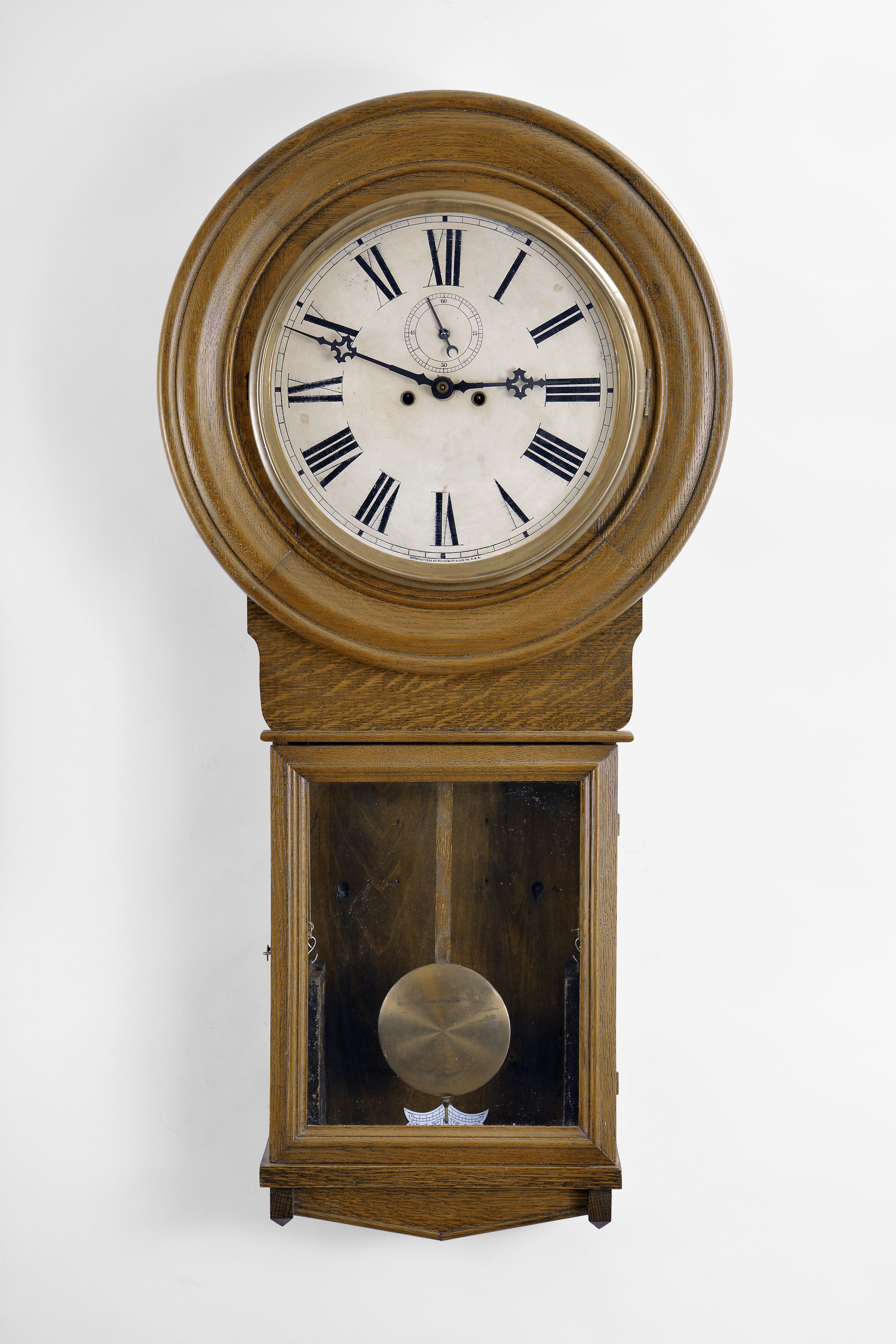 Waterbury Clock Co., Waterbury, Conn. "Regulator No. 20" wall clock with a double weight driven timepiece movement in an oak case. — Antique Clocks Price Guide